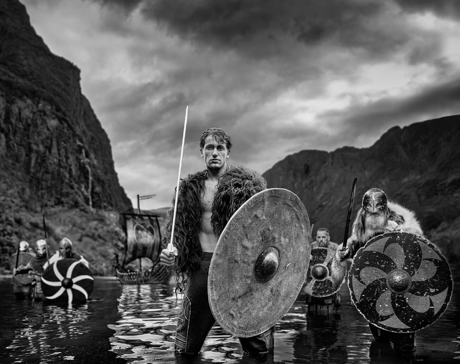 David Yarrow Black and White Photograph - 'The Viking' - Vikings standing in a Fjord, fine art photography, 2023