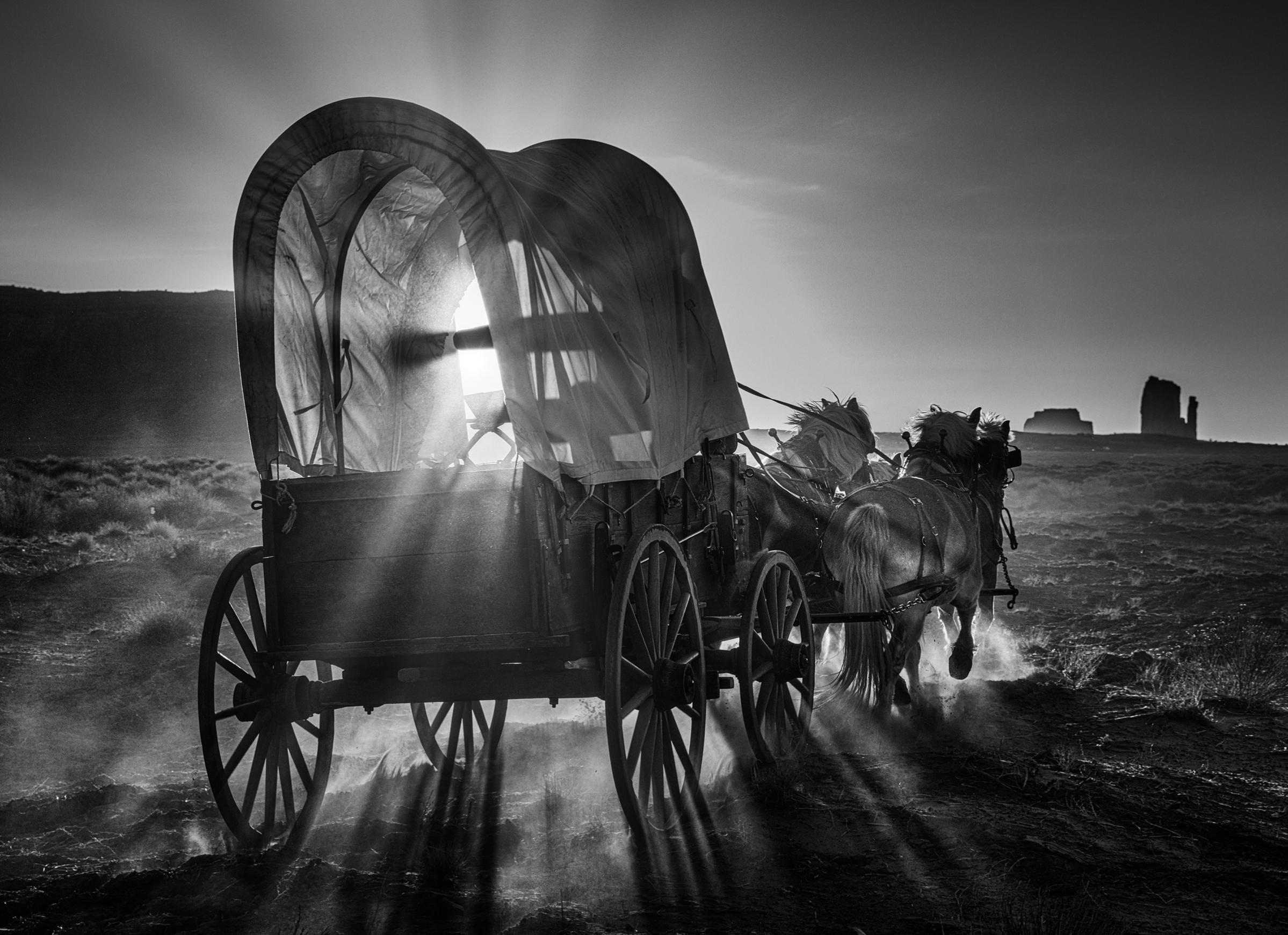 David Yarrow Black and White Photograph - Wagon Wheel