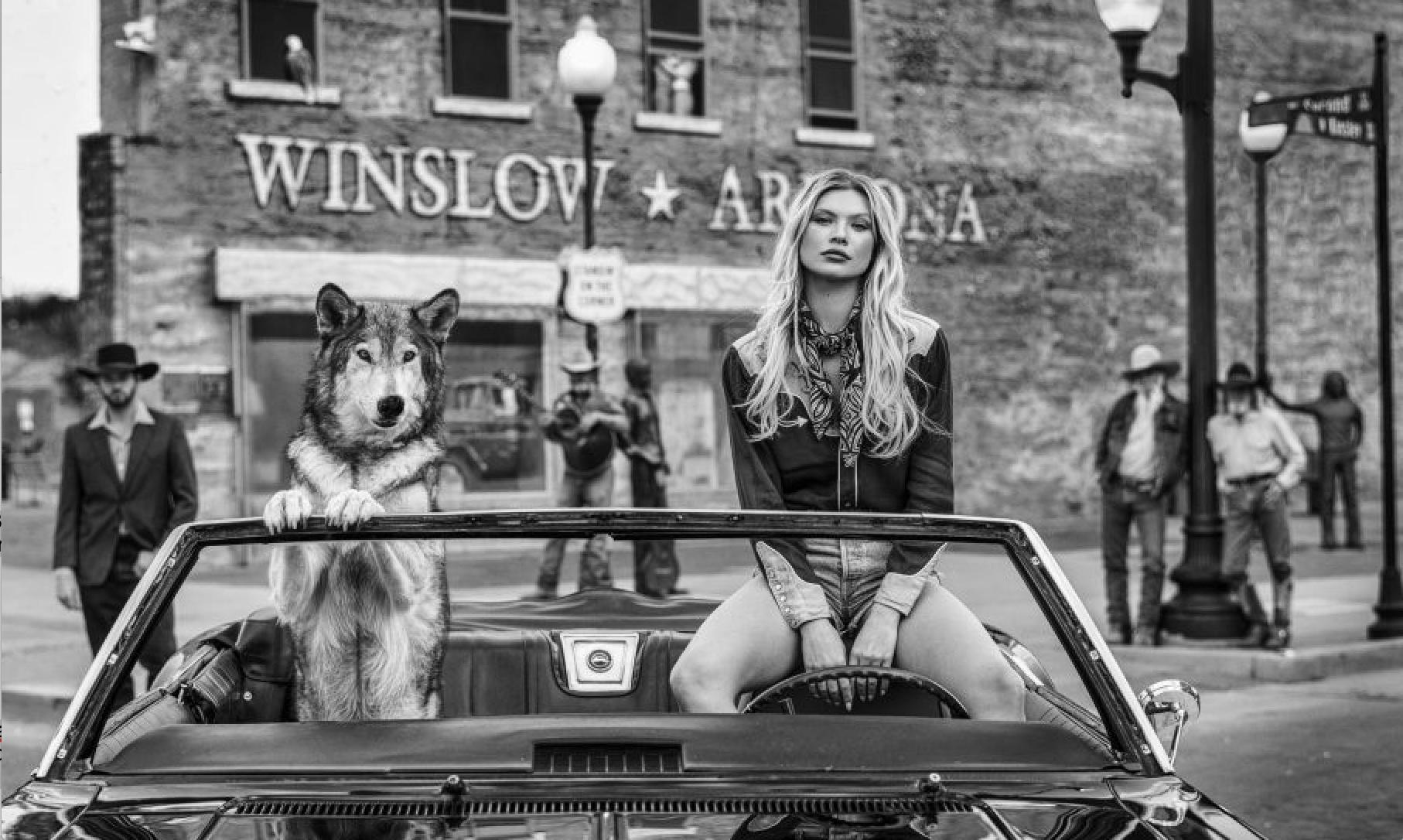 David Yarrow Black and White Photograph - WELL, I’M A-STANDIN’ ON A CORNER IN WINSLOW, ARIZONA