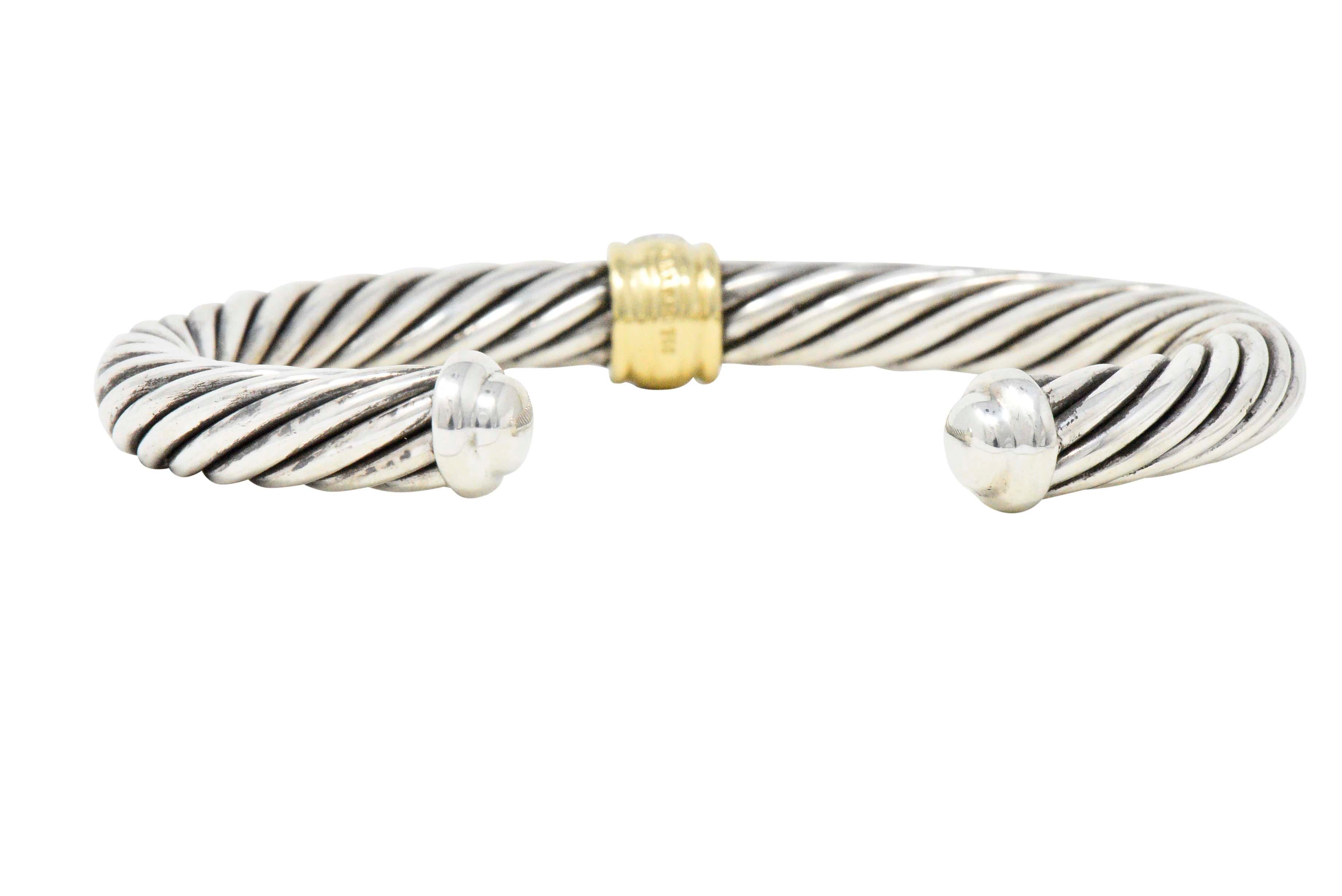 Cuff stye bangle bracelet centering round brilliant cut pavé set diamonds, weighing approximately 0.30 carats total, G/H color and VS to SI clarity
Twisted sterling silver with polished gold accents and polished silver terminals
Signed D.Y. 
Length: