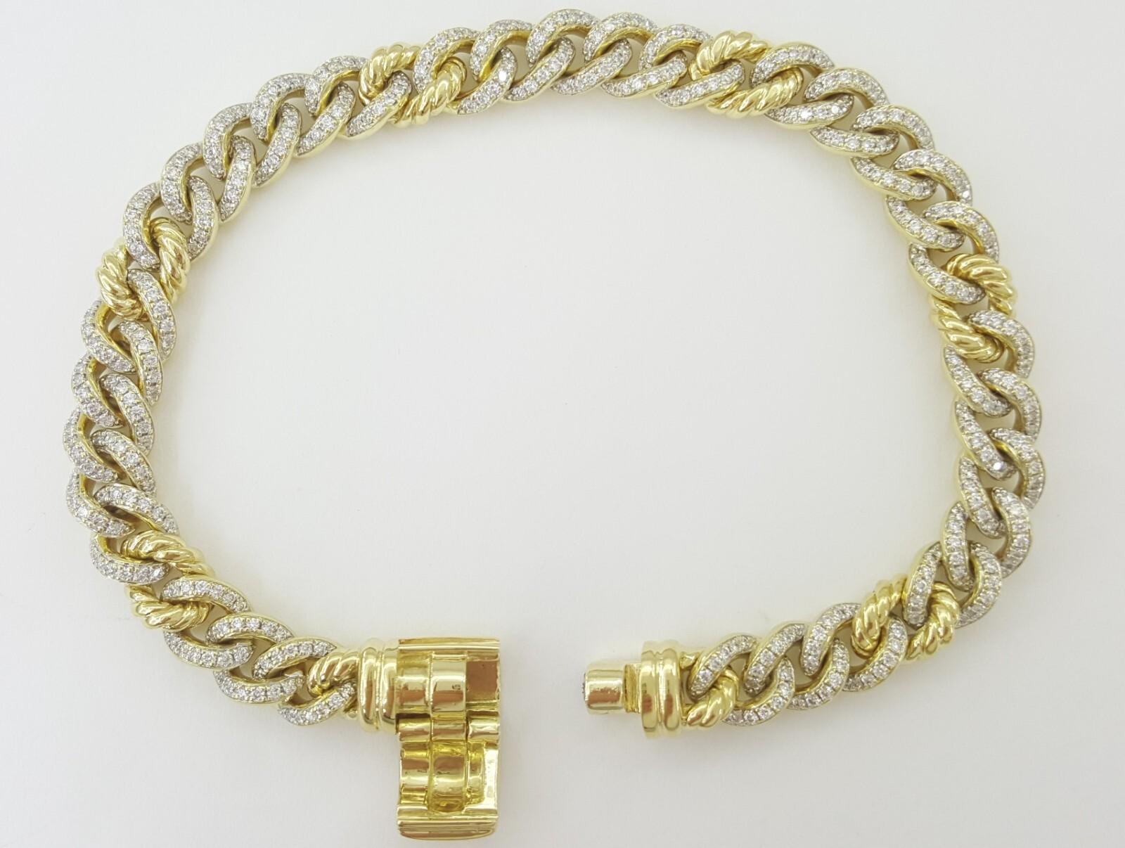 David Yurman 0.92 ct 18K Yellow Gold Curb Chain Bracelet
There are 372 natural Round brilliant cut diamonds weighing approximately 0.92 ct D-F color VVS-VS clarity.

The bracelet weighs 32 grams, 6.5 mm, 7
