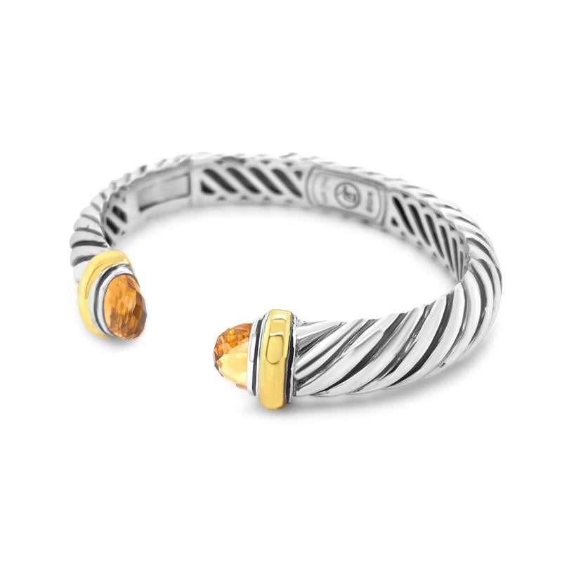 This David Yurman bracelet is crafted in sterling silver and 18 karat yellow gold with citrine gemstones. This is a size medium. 
Condition: Excellent. Light scratches but this piece has been professionally polished by our master jewelers.