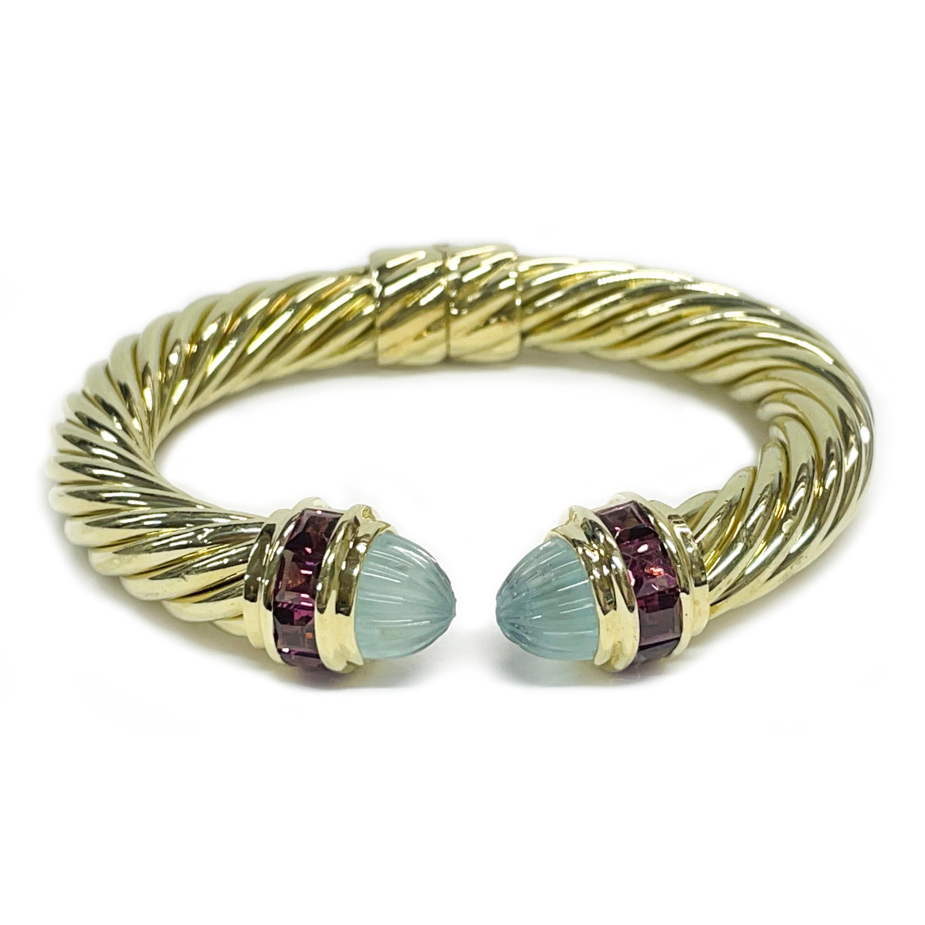 David Yurman 14 Karat Yellow Gold Aquamarine Pink Tourmaline Renaissance Hinged Cuff Bracelet. The Yurman classic cable design creates movement, texture, and depth. Each end cap features a light-colored carved bullet aquamarine cabochon and five