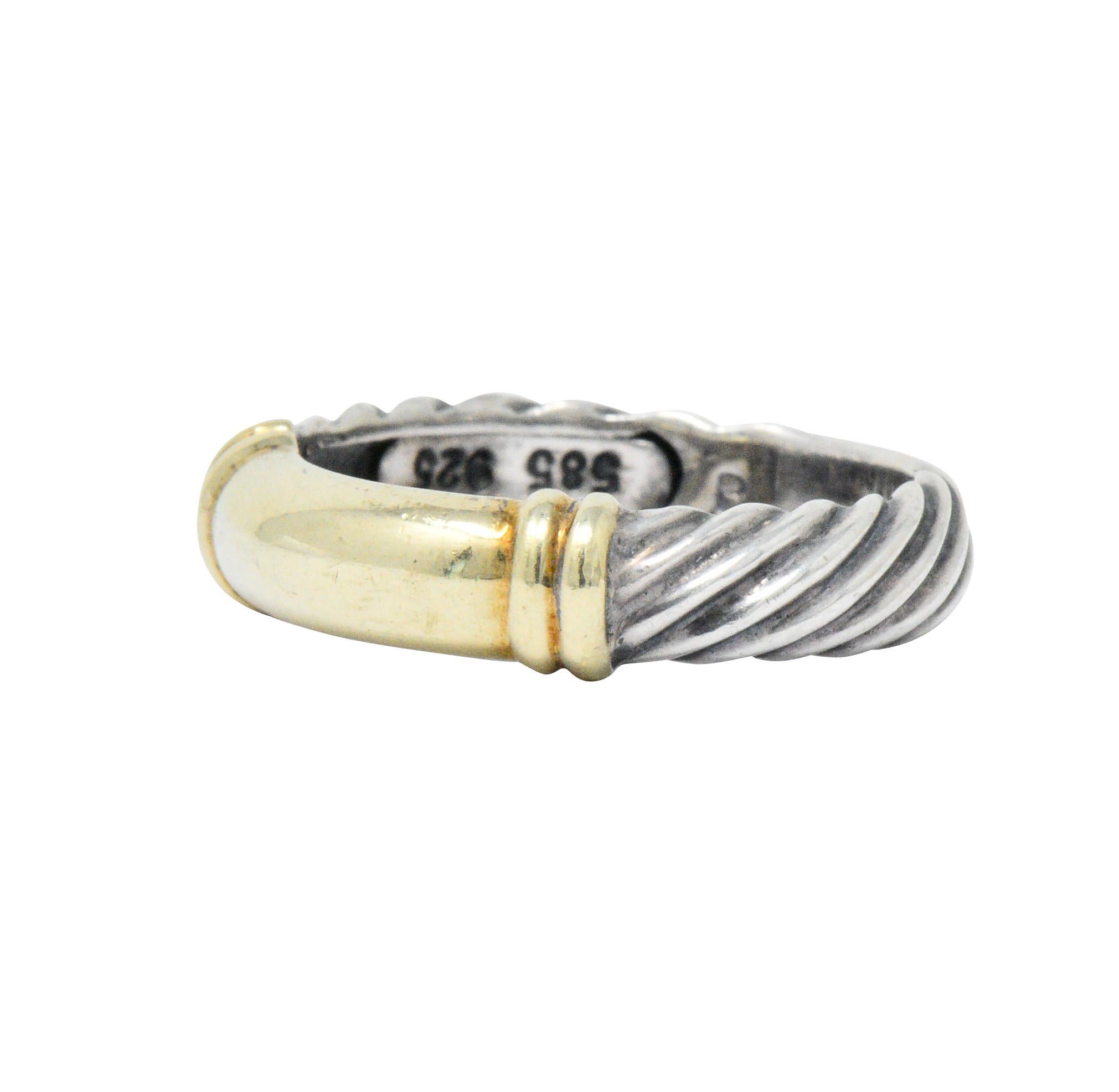 Featuring 14k gold wide center focal point with ribbed accents on each side

Band completed with classic sterling silver cable twist 

Signed 925 585 D. Yurman

3 mm wide band

Total Weight: 3.4 grams

Ring Size: 6.5 and sizable

Stylish.