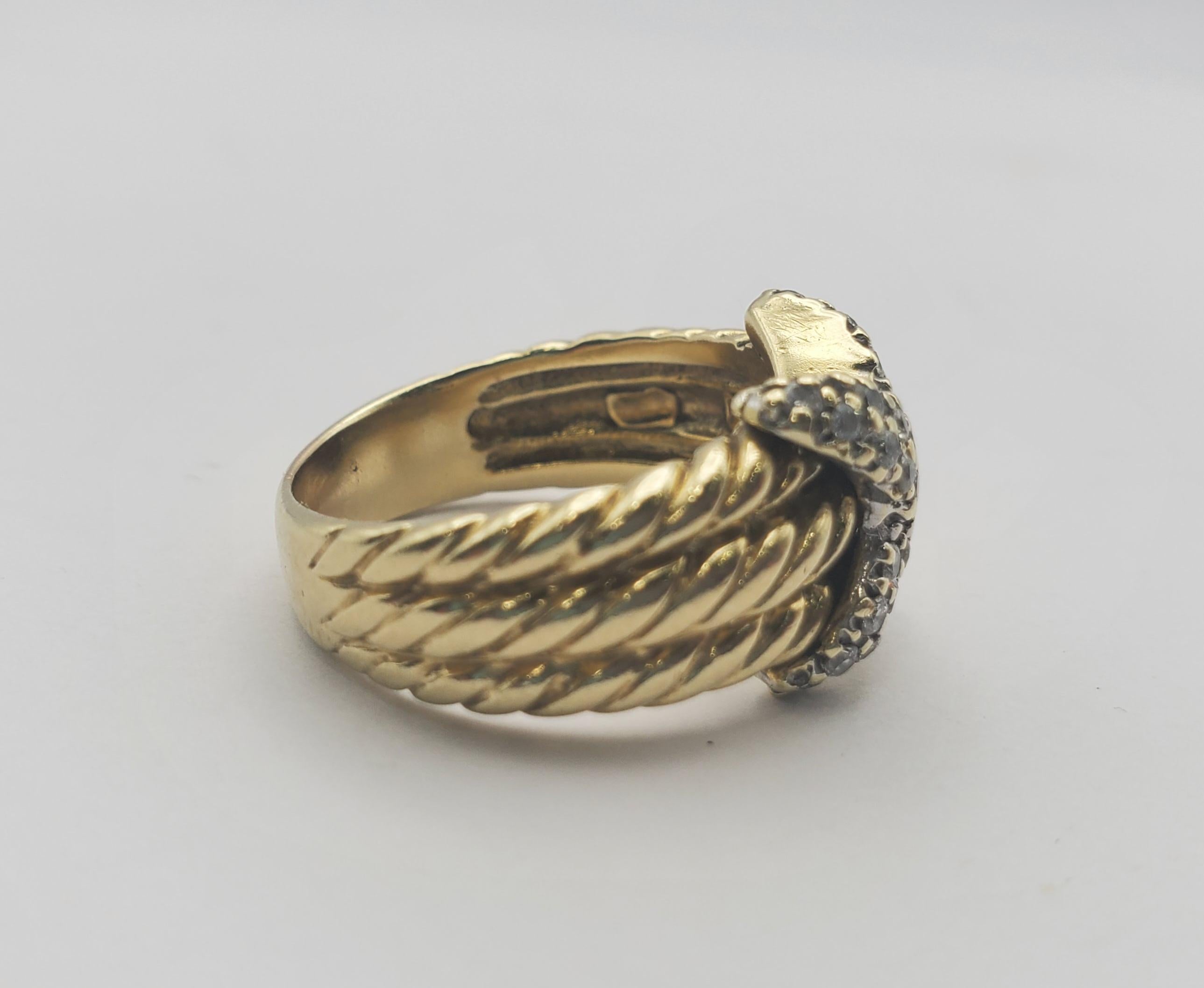 Stunning David Yurman 14k white and yellow cable X ring with round diamonds. The ring contains 33 round diamonds with a combined weight of 0.38tw. The diamonds are G-H in color and VS in clarity. This piece features the sculpted cable motif that is
