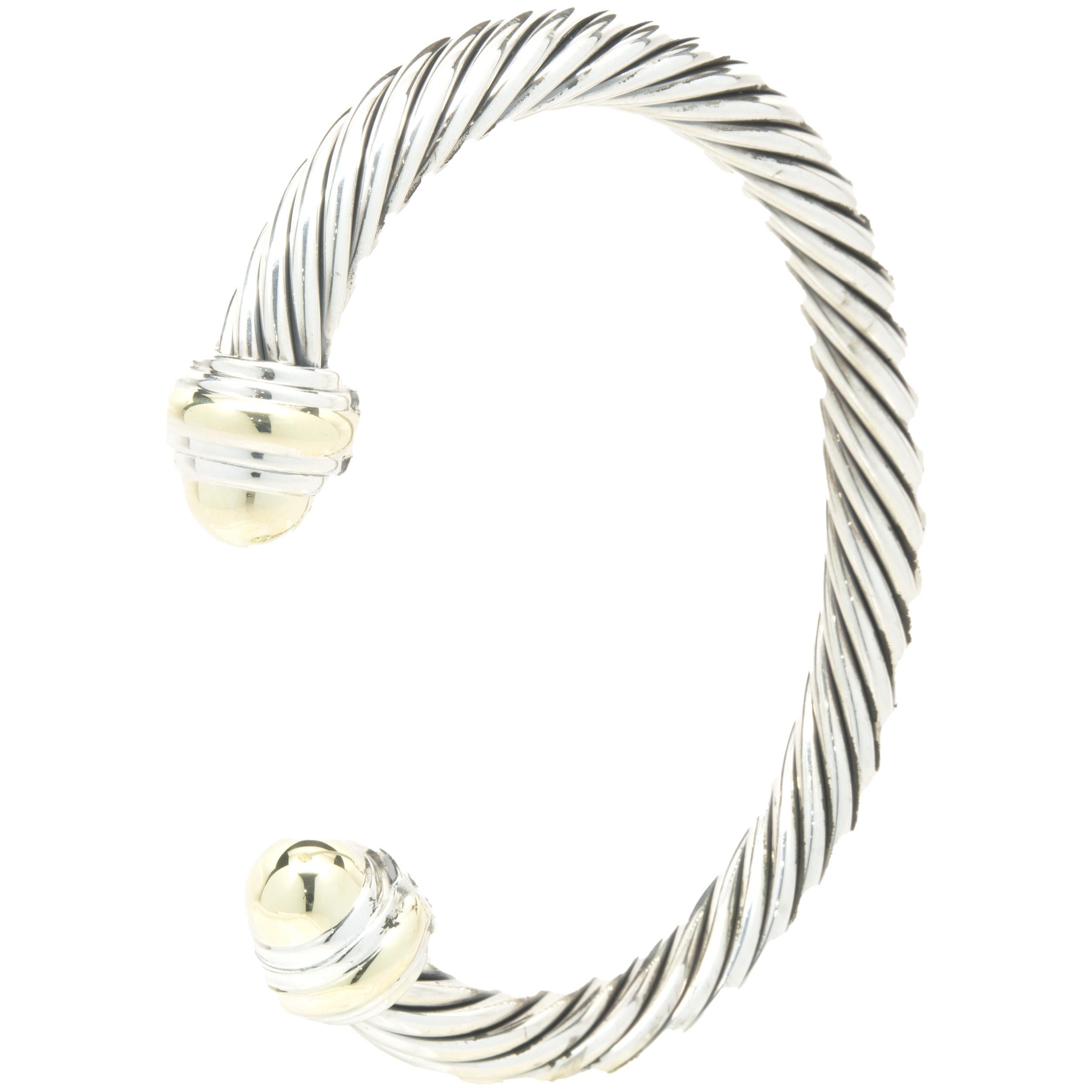 Designer: David Yurman
Material: sterling silver & 14k yellow gold
Dimensions: bracelet will fit a 7-inch wrist

Guaranteed authentic by seller