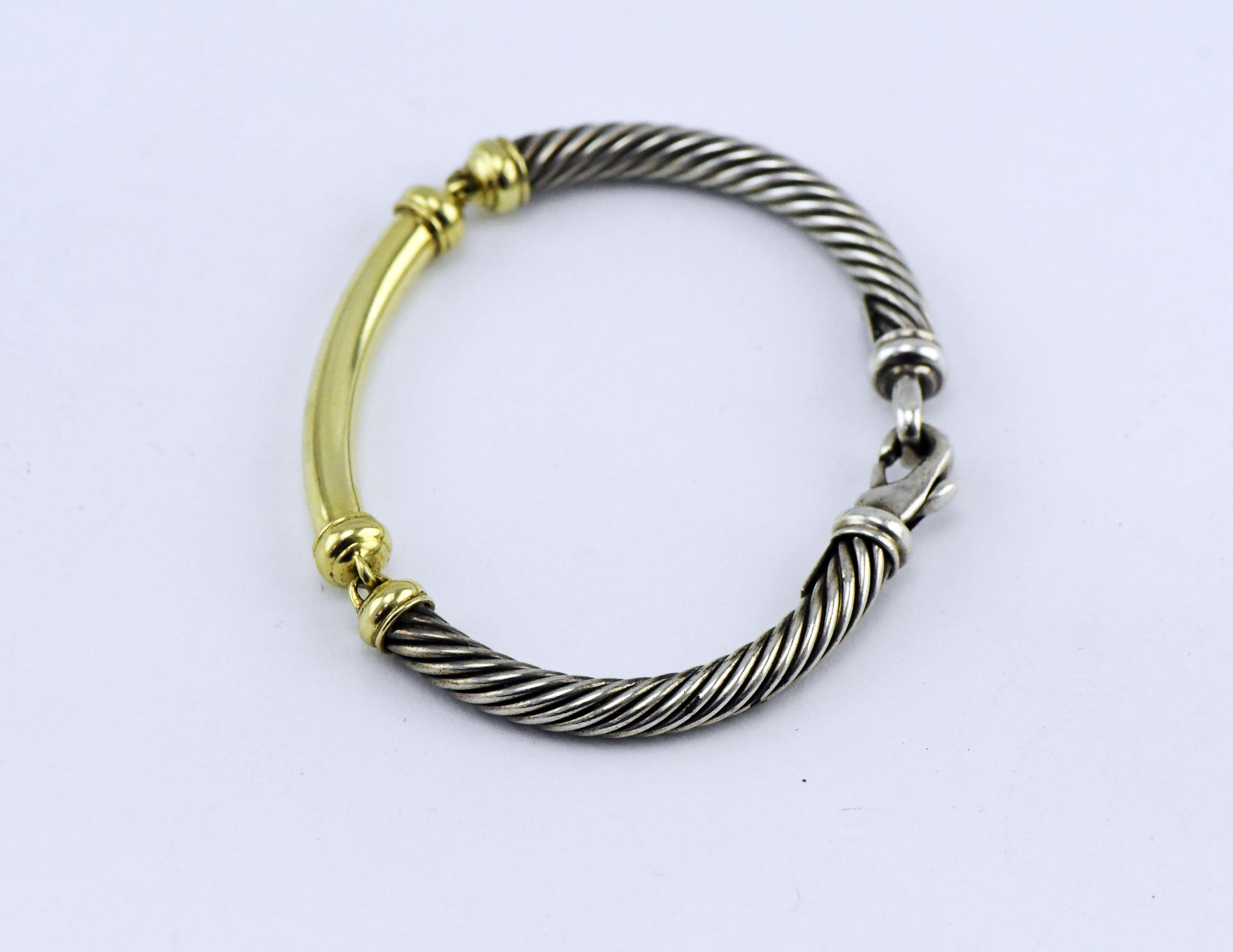David Yurman 14k Sterling Cable Cuff Bracelet.  David Yurman is a timeless model of inspiration, innovation and consummate craftsmanship. America's foremost luxury jewelry and timepiece brand, the company was founded in New York City by David, a