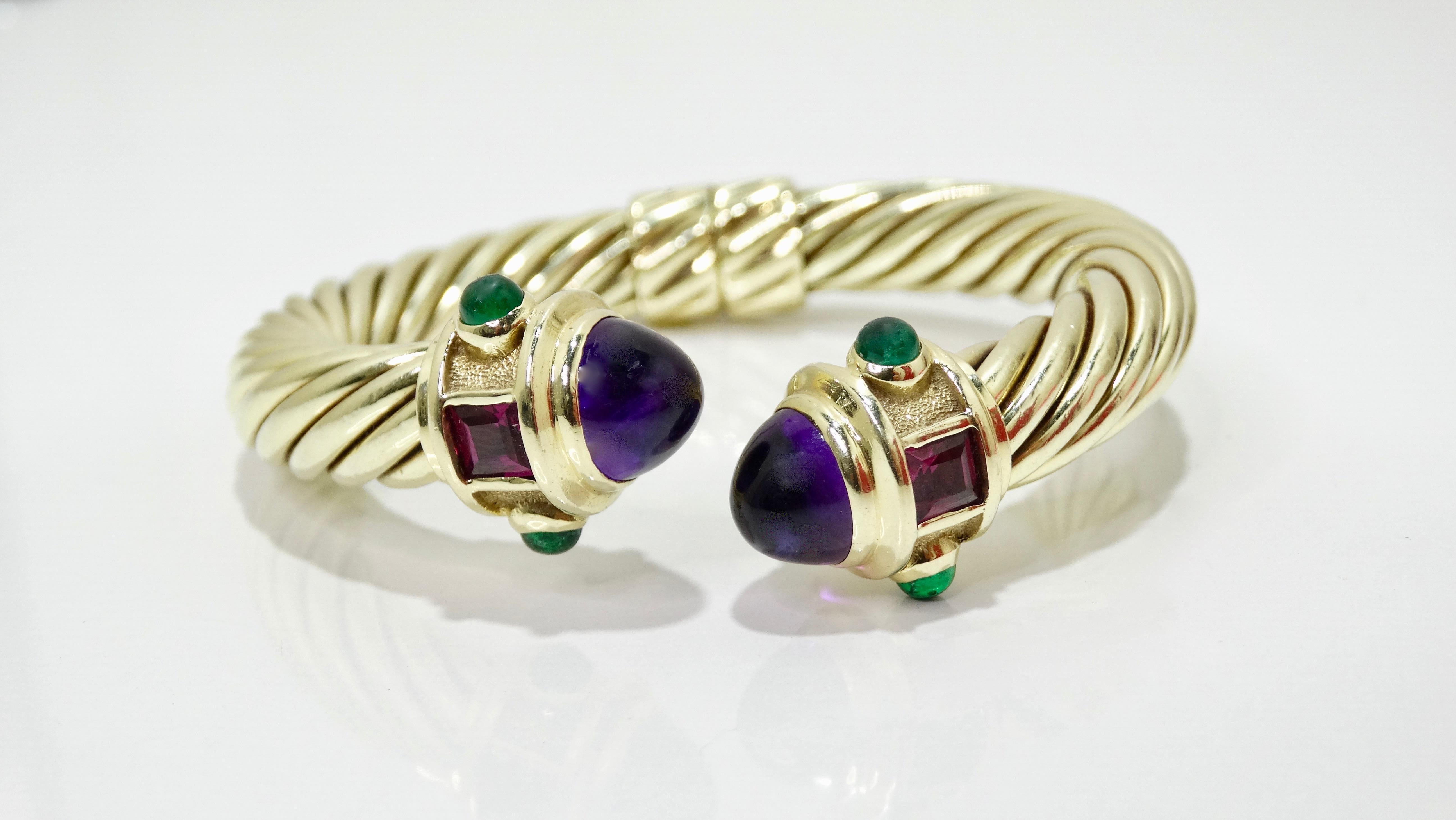 Say hello to your new favorite bracelet! Circa 1980s from David Yurman's Renaissance collection, this bracelet is crafted from 14k gold and sterling silver and features a twisted cable design with two large Cabochon Amethysts, two Tourmaline stones