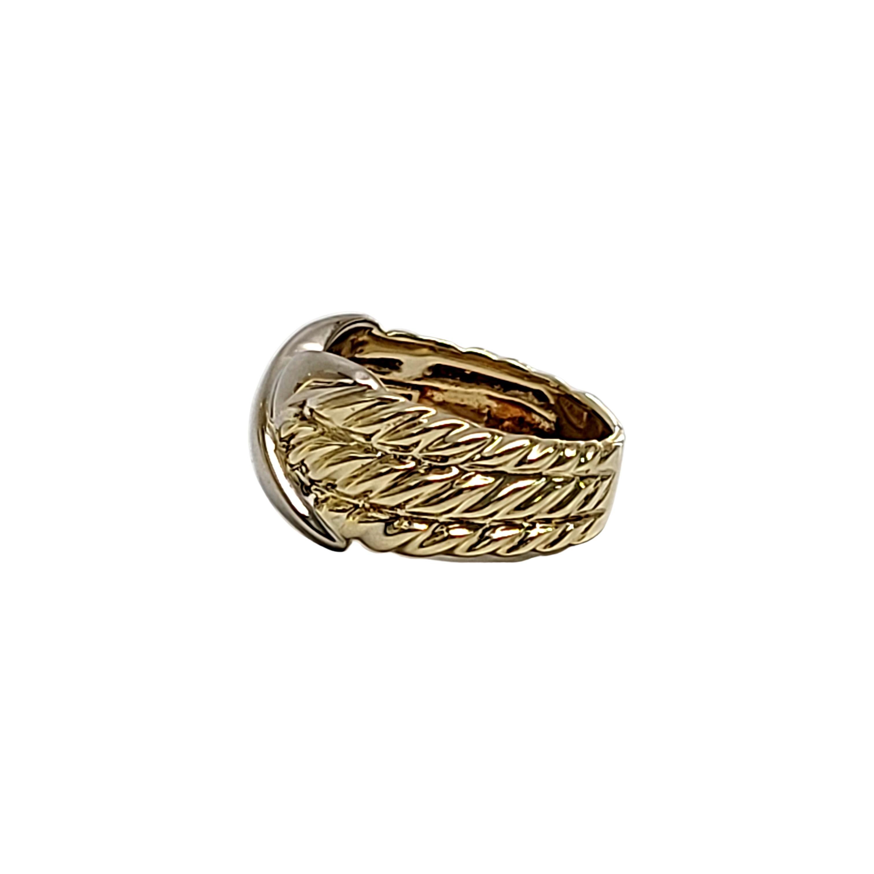 14K yellow and white gold Crossover X ring by David Yurman.

Size 5.75

Features a white gold X at its center with 3 rows of yellow cable bands on each side. Tapers to a smooth back.

Measures 10mm high at front, 5 mm wide at back.

Weighs 7g,