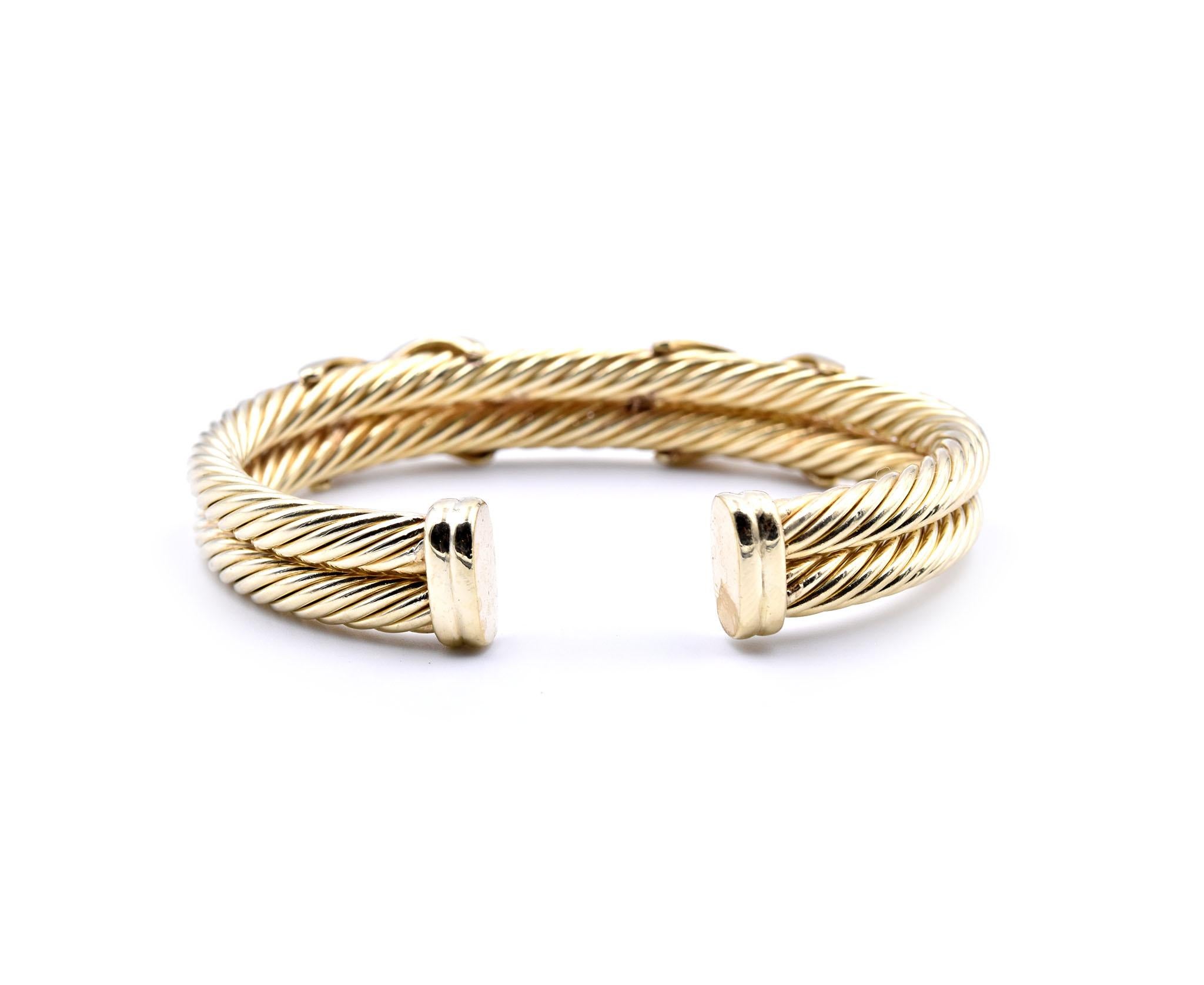 Designer: David Yurman
Material: 14k yellow gold
Diamonds: 10 round brilliant cuts = 0.50cttw
Color: G
Clarity: VS
Dimensions: bracelet will fit up to a 6-inch wrist
Weight: 33.29 grams
