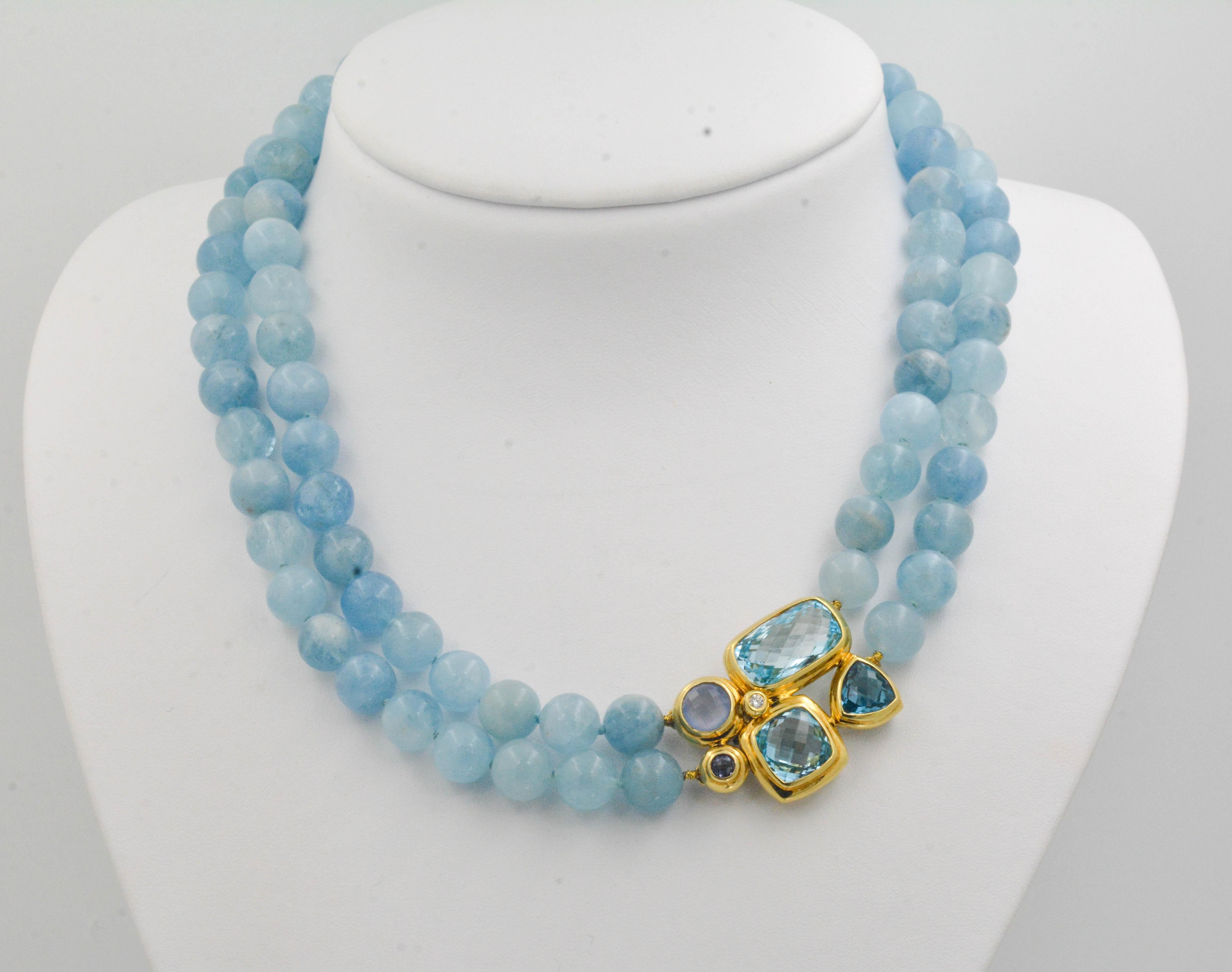 Make a statement with this exclusive David Yurman beaded topaz necklace, featuring an exquisite multi-stone clasp in 18 karat yellow gold and sterling silver. The clasp is set with three faceted blue topaz weighing 27.04 carats, one blue moonstone