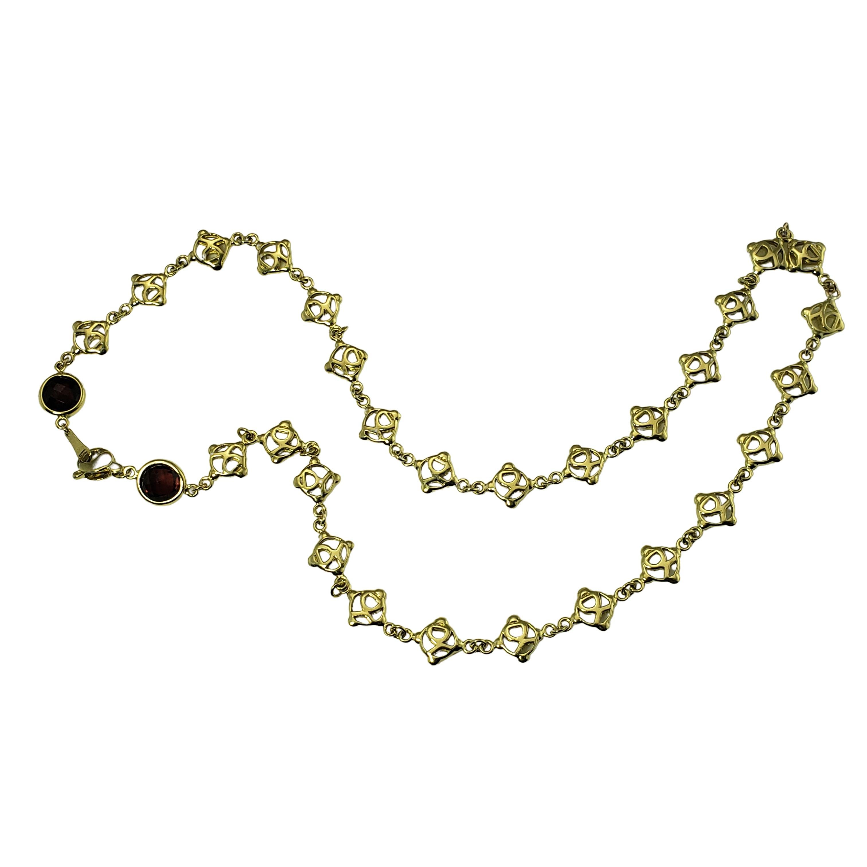 Vintage David Yurman 18 Karat Yellow Gold and Garnet Logo Link Necklace-

This stunning David Yurman necklace is crafted in 18K yellow gold featuring D.Y. logo links with two bezel set garnets (9 mm each). Width: 9 mm.

Size: 19.25