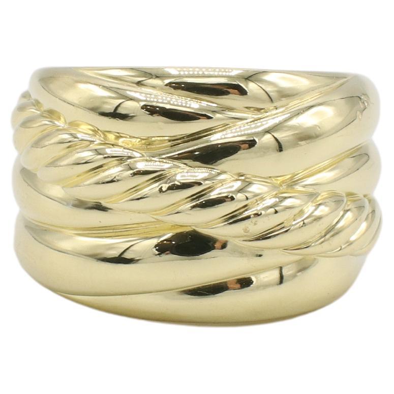 David Yurman 18 Karat Yellow Gold Crossover Band Ring 
Metal: 18k yellow gold
Weight: 17.9 grams
Size: 7 (US)
Width: 9-16mm
Signed: ©D.Y. 750
