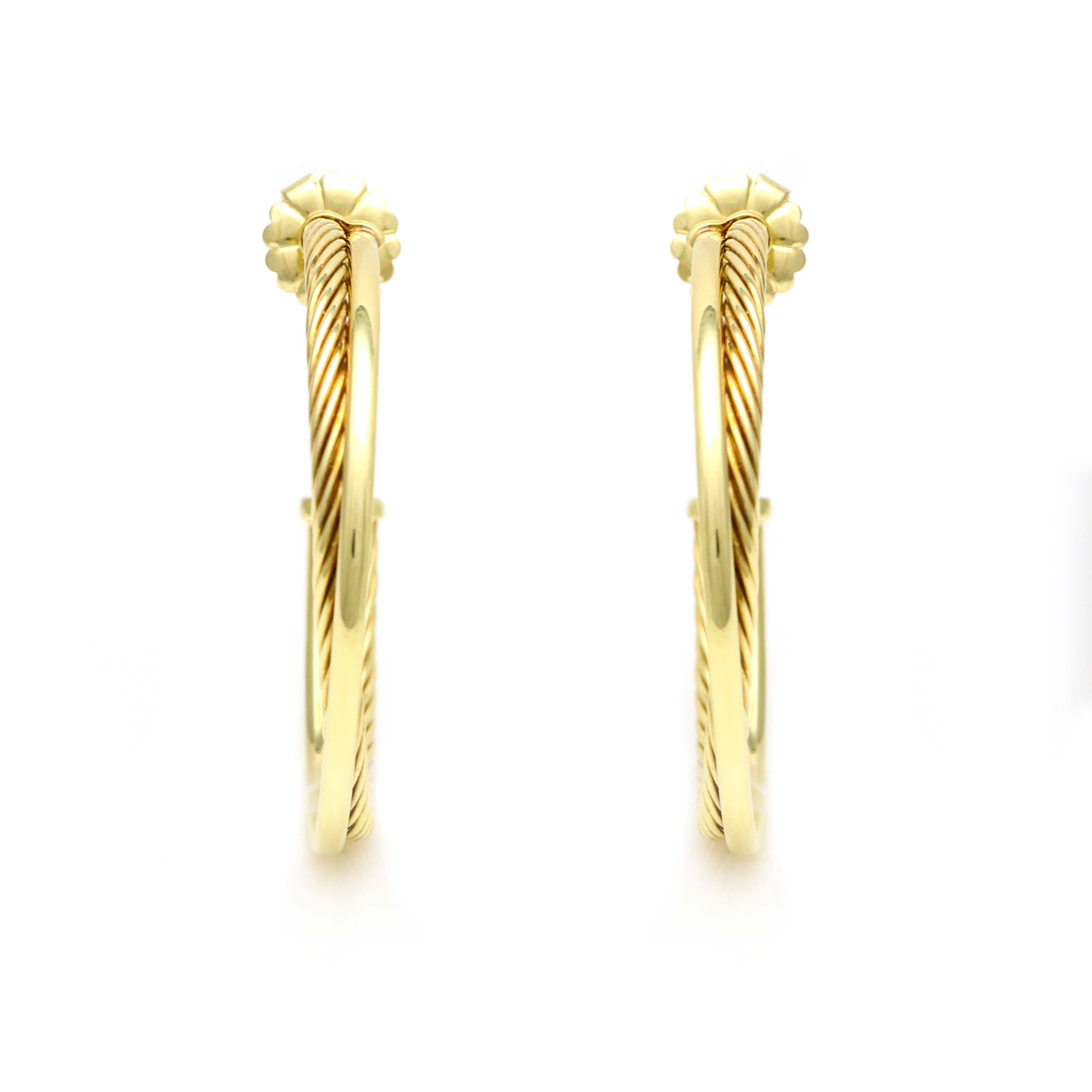 David Yurman large crossover hoop earrings crafted in 18 karat yellow gold. Butterfly backs. Diameter, 44mm. Width, 5mm. 