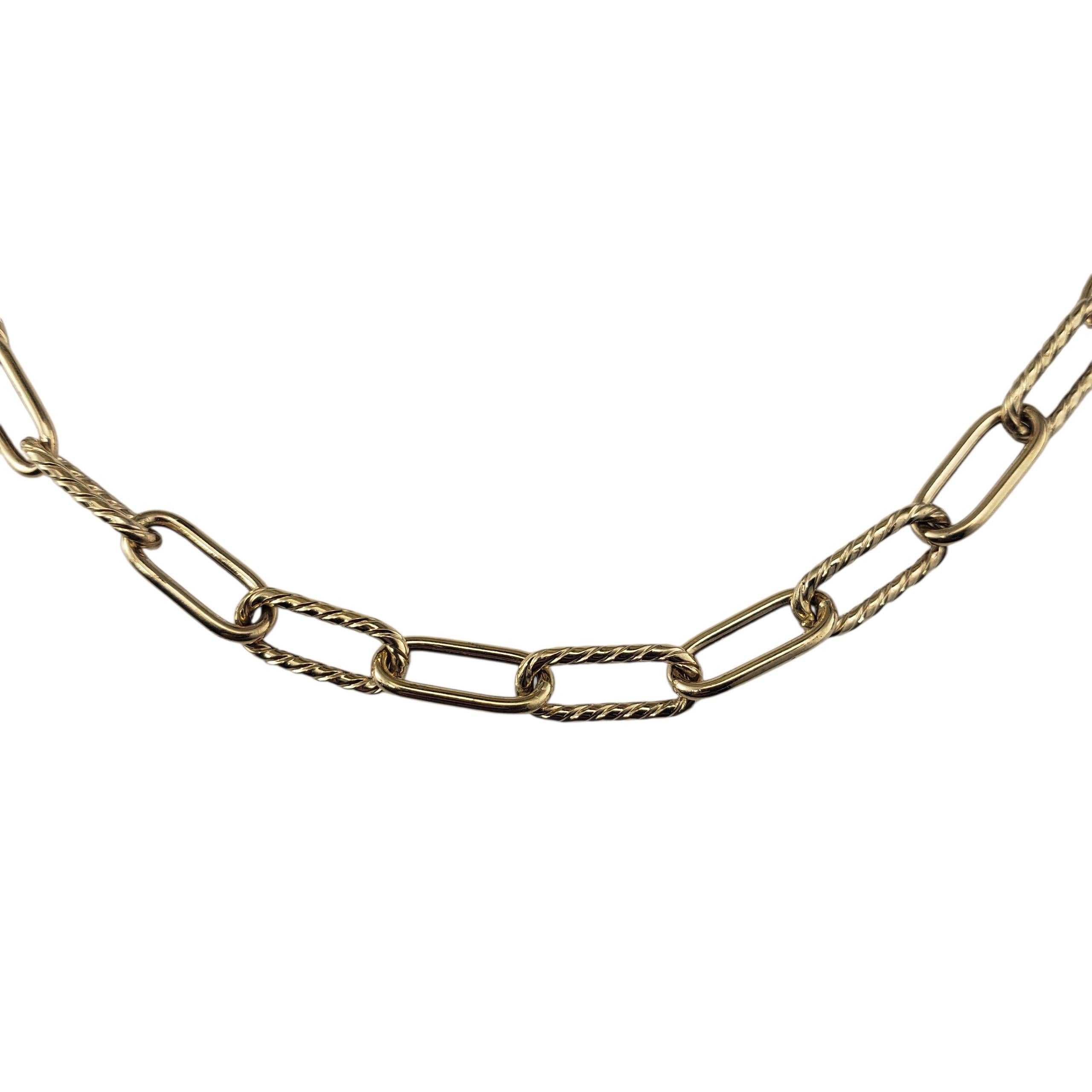 David Yurman 18K Yellow Gold Mixed Link Necklace-

This elegant David Yurman 18K yellow gold necklace features alternating smooth oval links and signature cable-motif links, showcasing the brand's iconic aesthetic. Perfect on its own or layered with