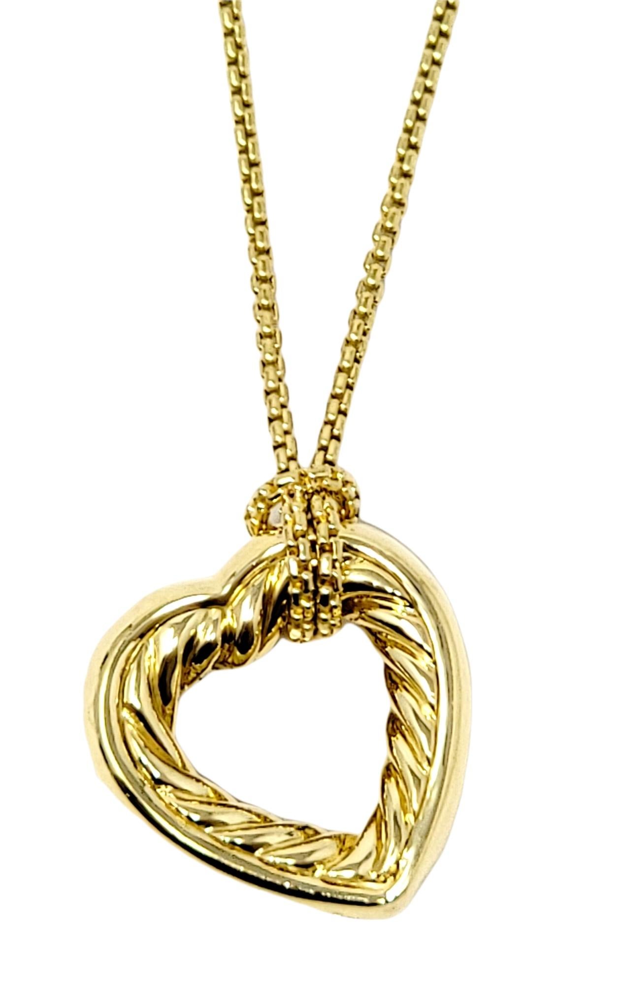 This beautiful designer necklace by David Yurman features a polished 18 karat yellow gold cable open heart pendant set at a slight diagonal and arranged on a delicate box chain.

Necklace type: Pendant
Metal: 18K Yellow Gold
Weight: 25.8 grams
Chain