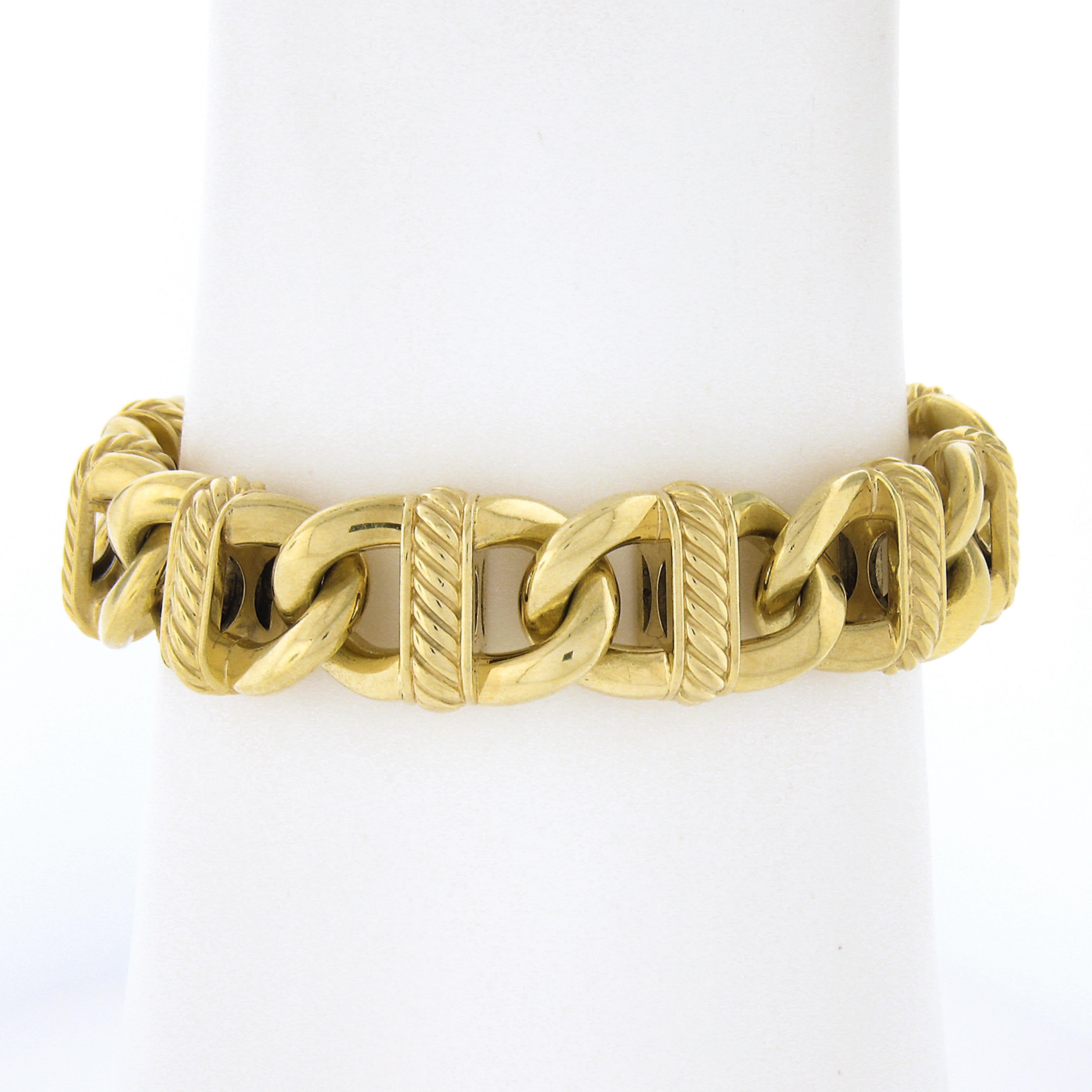 You are looking at a gorgeous unisex wide heavy bracelet by David Yurman crafted in solid 18k yellow gold and features an open cable link with twisted wire design at the middle of each link. This bracelet have a nice bold appearance that looks