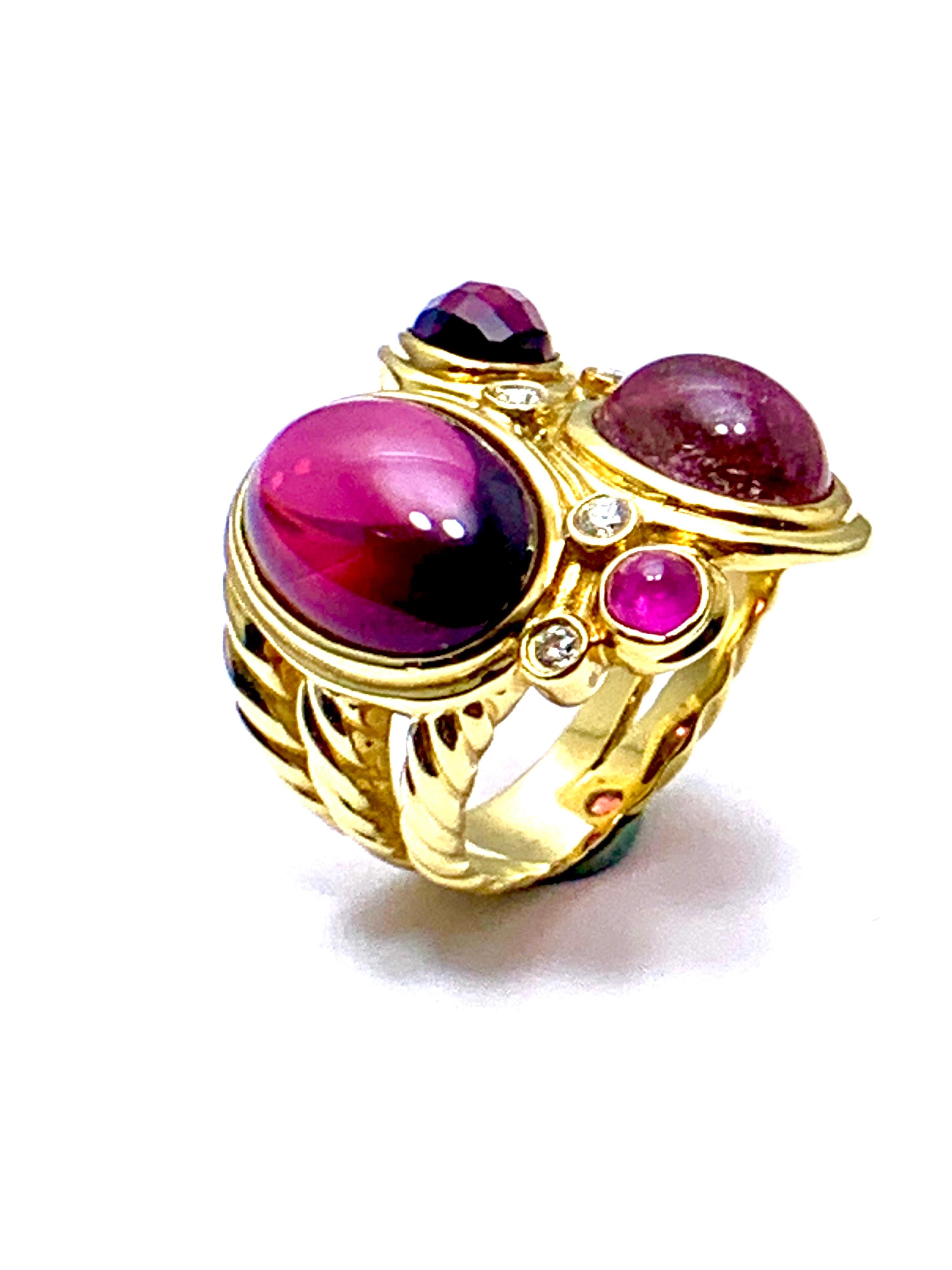 An estate David Yurman 18K yellow gold mosaic ring with Rhodolite Garnet, Pink Tourmaline and round brilliant-cut Diamonds.  The Diamonds are 0.15 total carat weight, G-H color, VS1-2 clarity.  The gemstones include Rhodolite Garnet, Tourmaline, and