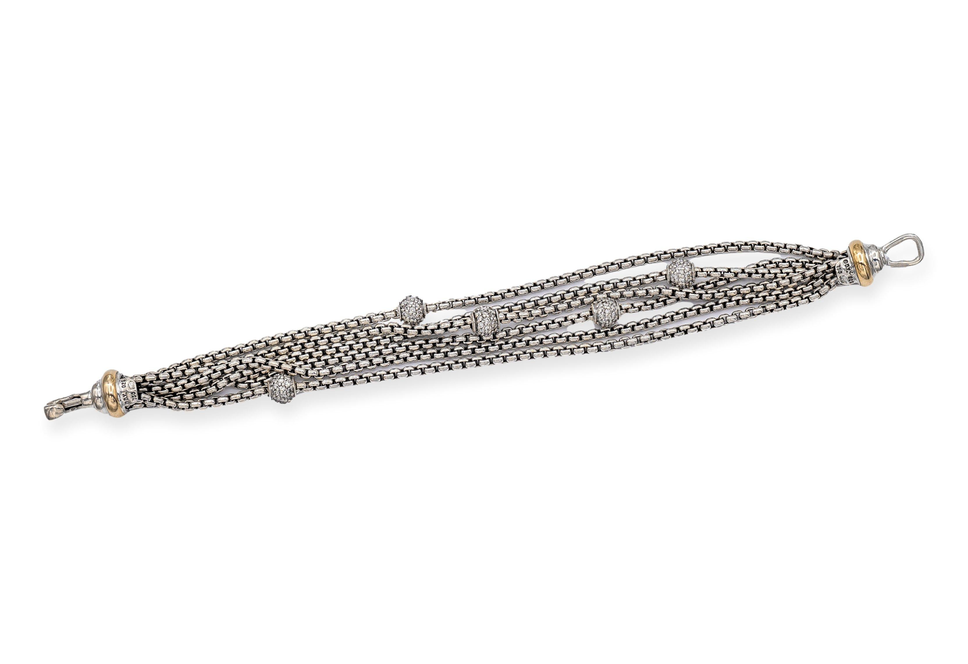 David Yurman bracelet finely crafted in sterling silver featuring 6 strands of the DY signature link chain accented by 5 pave bead set diamond ball stations weighing 0.80 carats total weight approximately. Bracelet measures 6.5 inches long with a