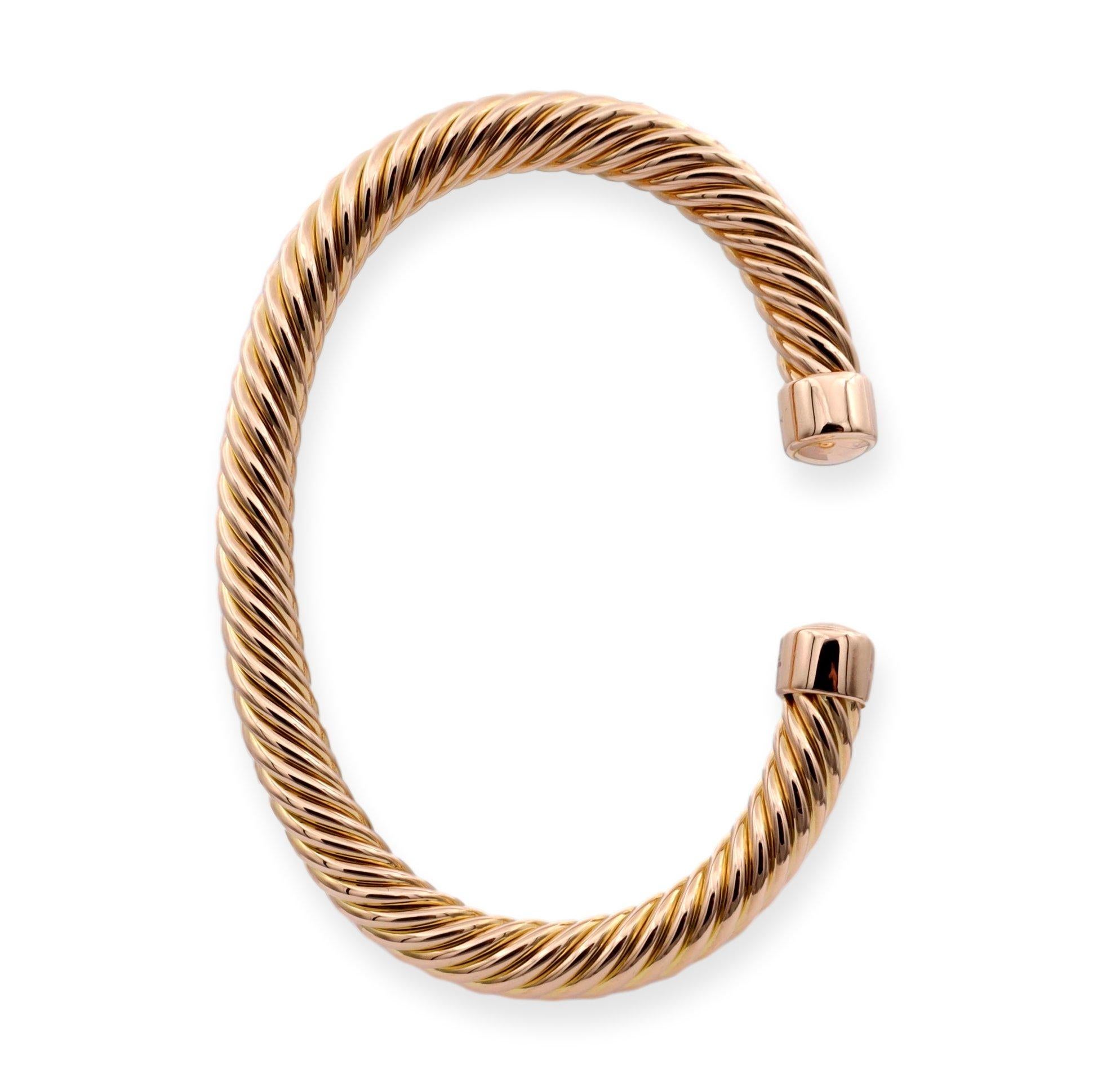 David Yurman open cuff bangle bracelet from the Men's cable collection finely crafted in 18 karat rose gold in a Medium size measuring 7 mm wide. Bracelet has a twisted cable design. Fully hallmarked with designer logo and metal content.

Bracelet