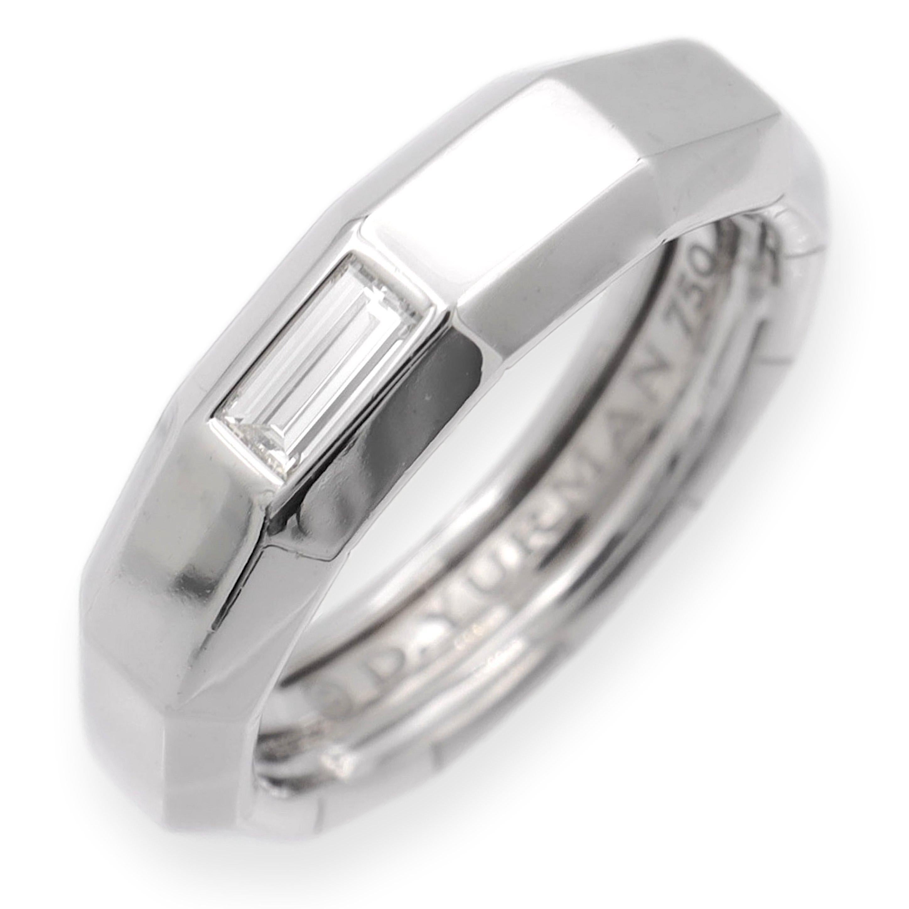 David Yurman Faceted Band Ring finely crafted in 18K White Gold with a Baguette Diamond center weighing 0.19 carats total weight in a fine white E color and VVS clarity. The ring has a mirror finish faceted design measuring 6mm wide.

Ring