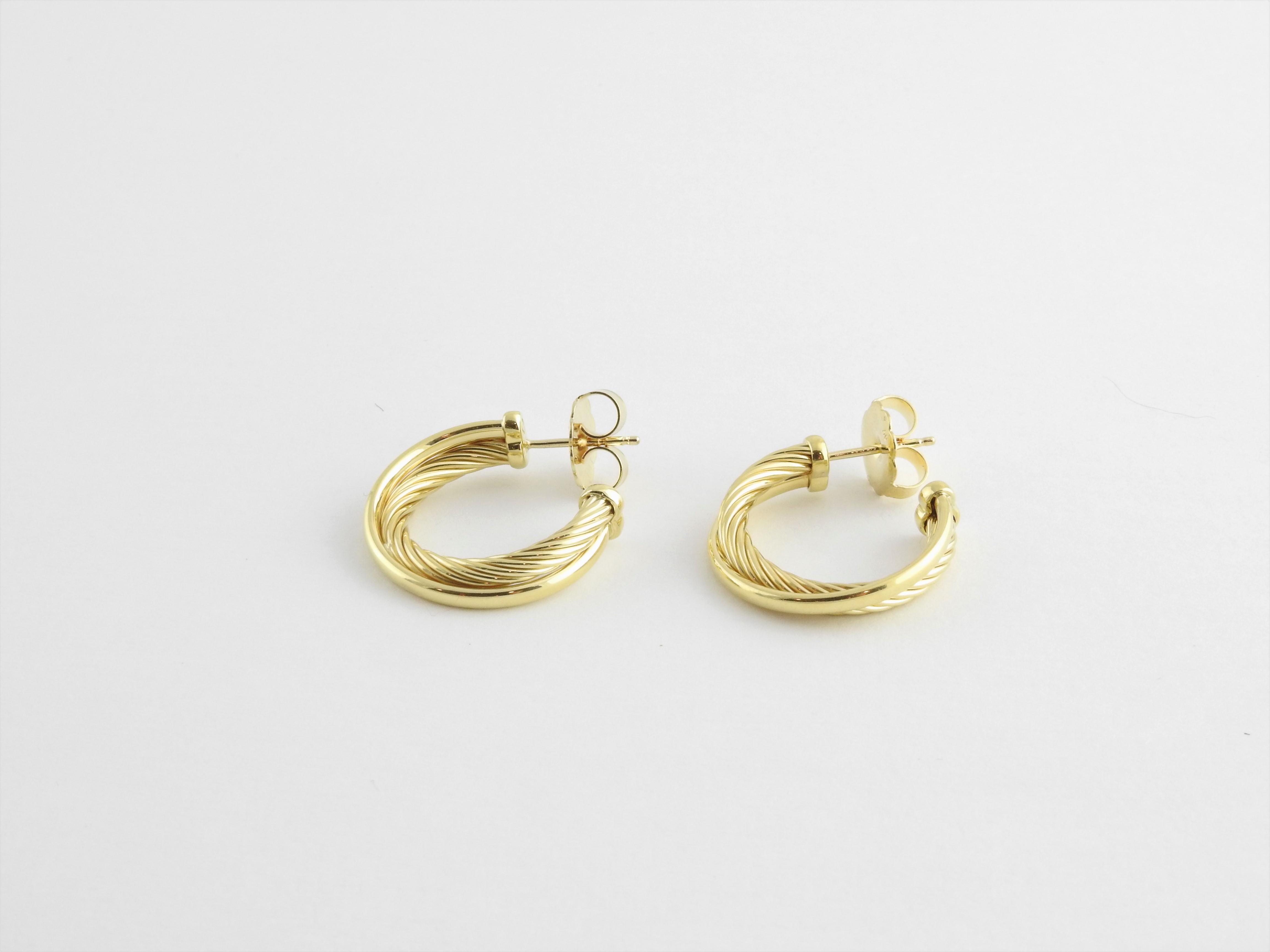David Yurman 18K Yellow Gold Cable Crossover Hoop Earrings

These authentic David Yurman hoop Earrings are approx. 24 mm in length and 5 mm wide ( 7/8