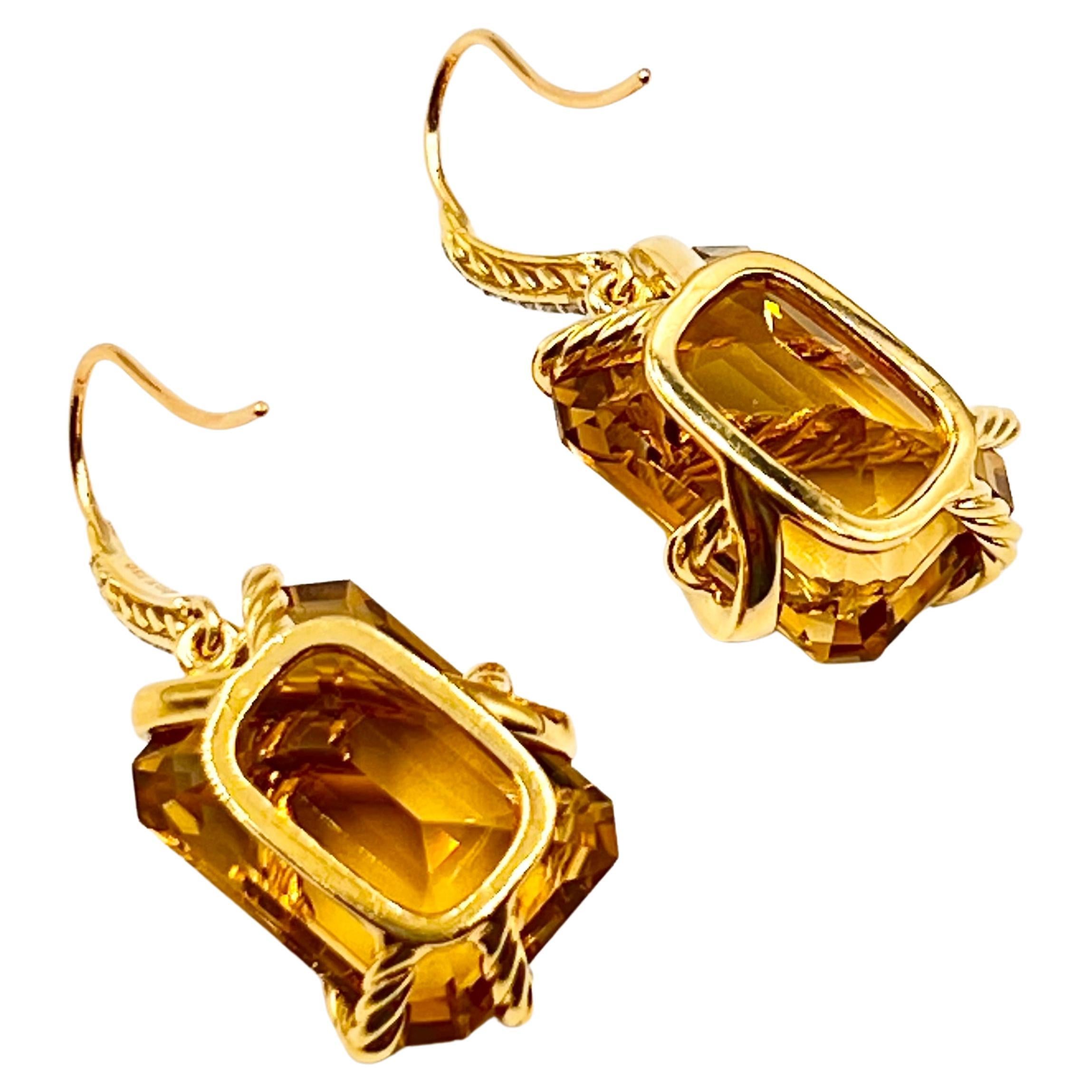 18k gold, citrine and diamond drop earrings by David Yurman.  Each having a vibrant yellowish orange-brown, rectangular emerald-cut citrine with a gold twist wrap accented by round brilliant-cut diamonds.  Gold frame back with pierced wire top