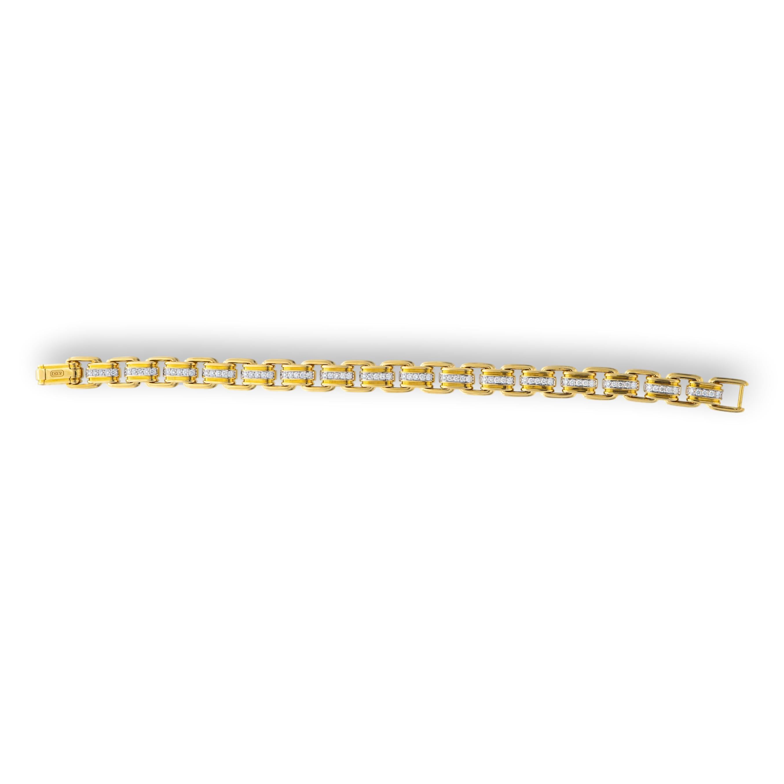 David Yurman Men's bracelet from the Deco collection finely crafted in 18 karat yellow gold featuring pave set round brilliant cut diamond link sections in white gold settings weighing 1.34 carats total weight in a chain link design measuring 8 