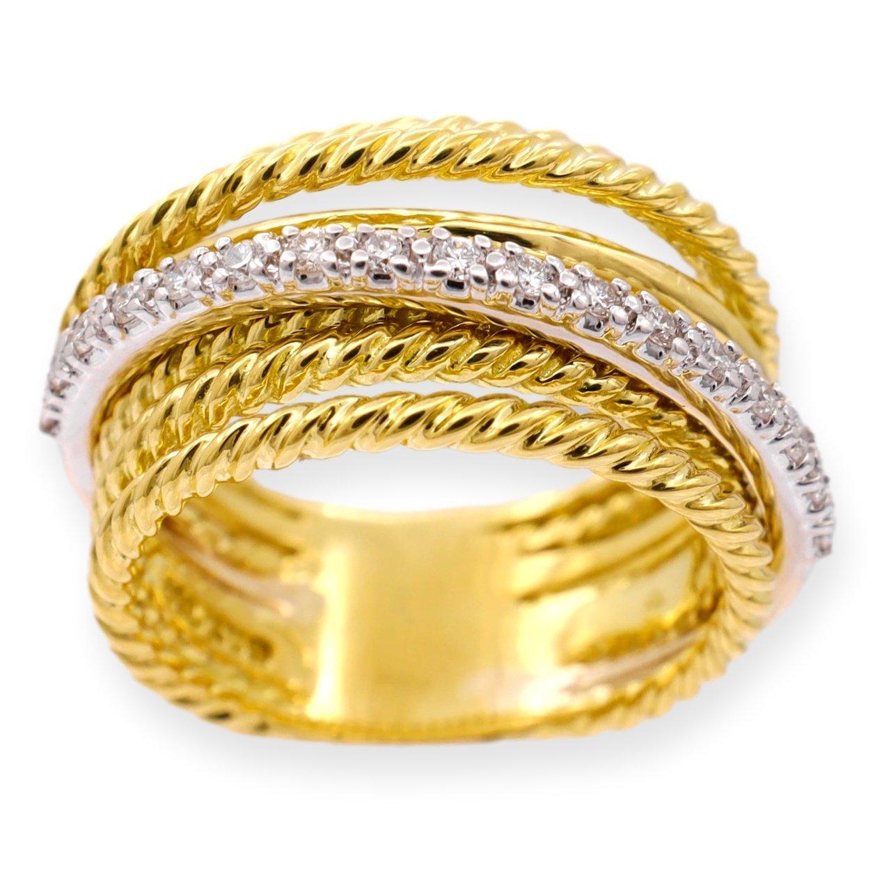 David Yurman Wide Band Ring from the captivating Crossover collection finely crafted in lustrous 18K yellow gold, this stunning piece showcases a harmonious fusion of design elements. The ring boasts seven rows of the signature cable rings, a