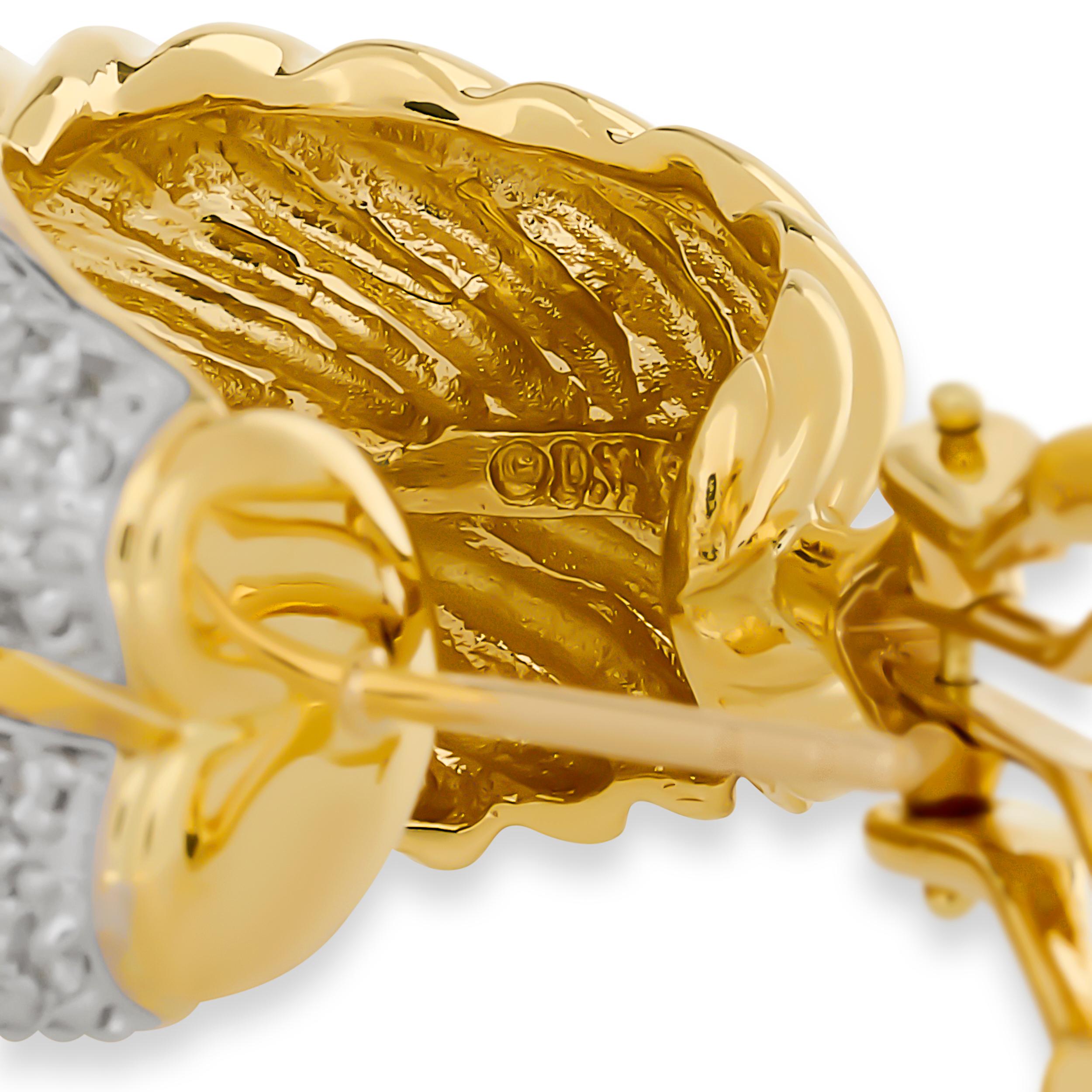 These striking David Yurman earrings feature a crossover design with one half composed of twisted yellow gold and the other half paved with brilliant-cut diamonds, creating a bold two-tone clip earring.

There are about 174 round diamonds that add