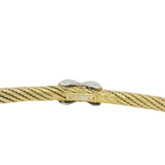 Pulsera rígida estrecha «Diamond X» de David Yurman, en oro amarillo de 18 quilates. Disponible