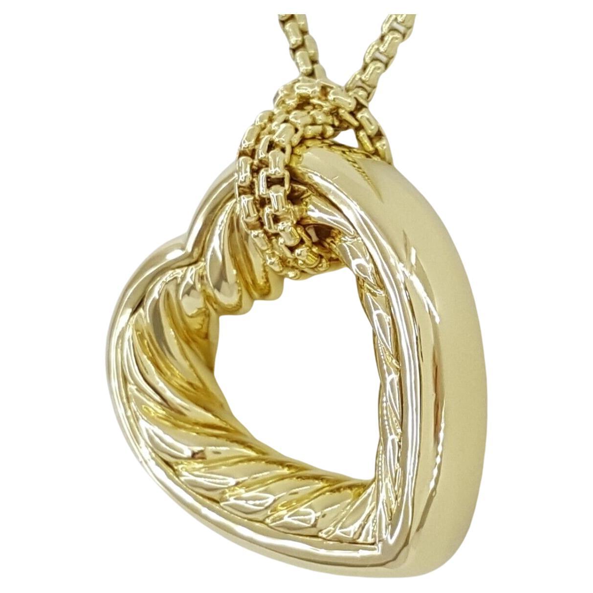 
This necklace features a David Yurman 18k Yellow Gold Heart Cable Pendant measuring 25 mm wide, accompanied by a 1.5 mm Round Box Link Chain spanning 20