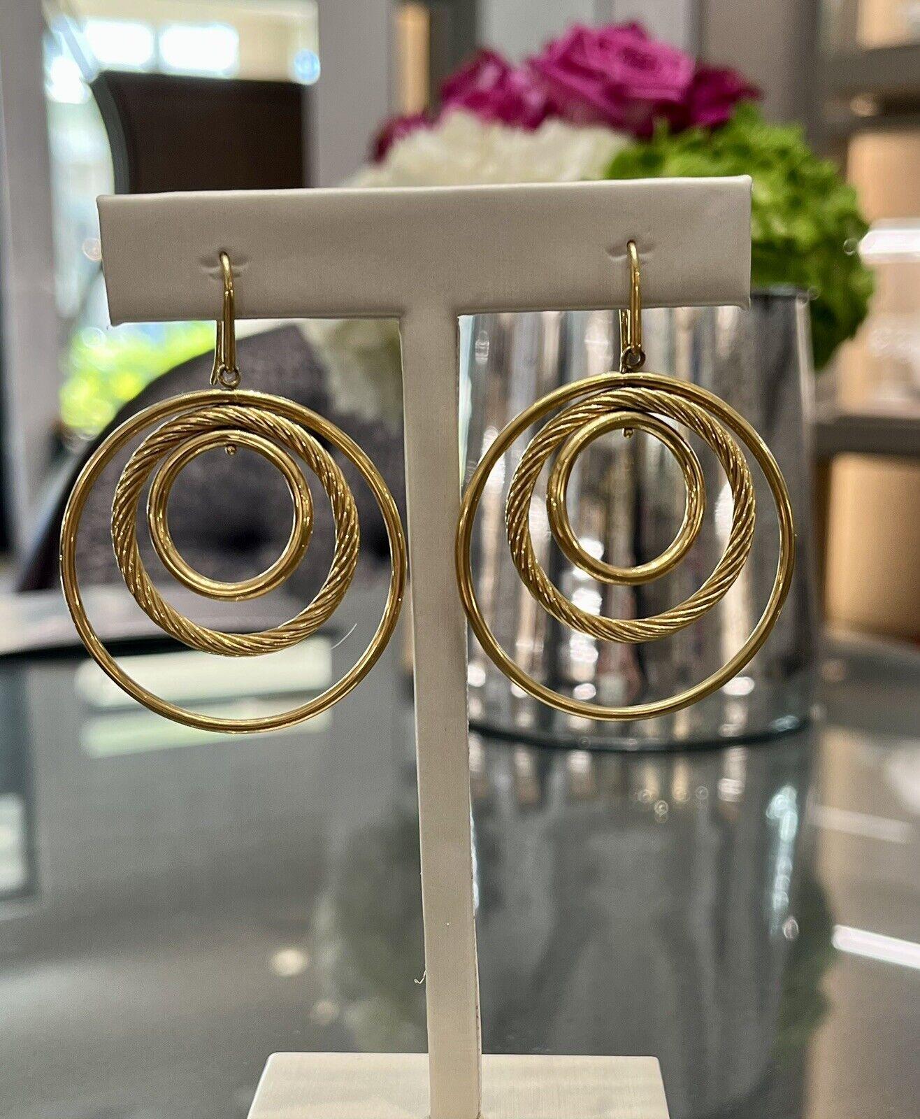 Elevate your elegance with the David Yurman 18K Yellow Gold Mobile Dangle Drop Earrings, a mesmerizing fusion of sophistication and craftsmanship. Impeccably crafted from 18K yellow gold and stamped 750 for authenticity, these exquisite earrings