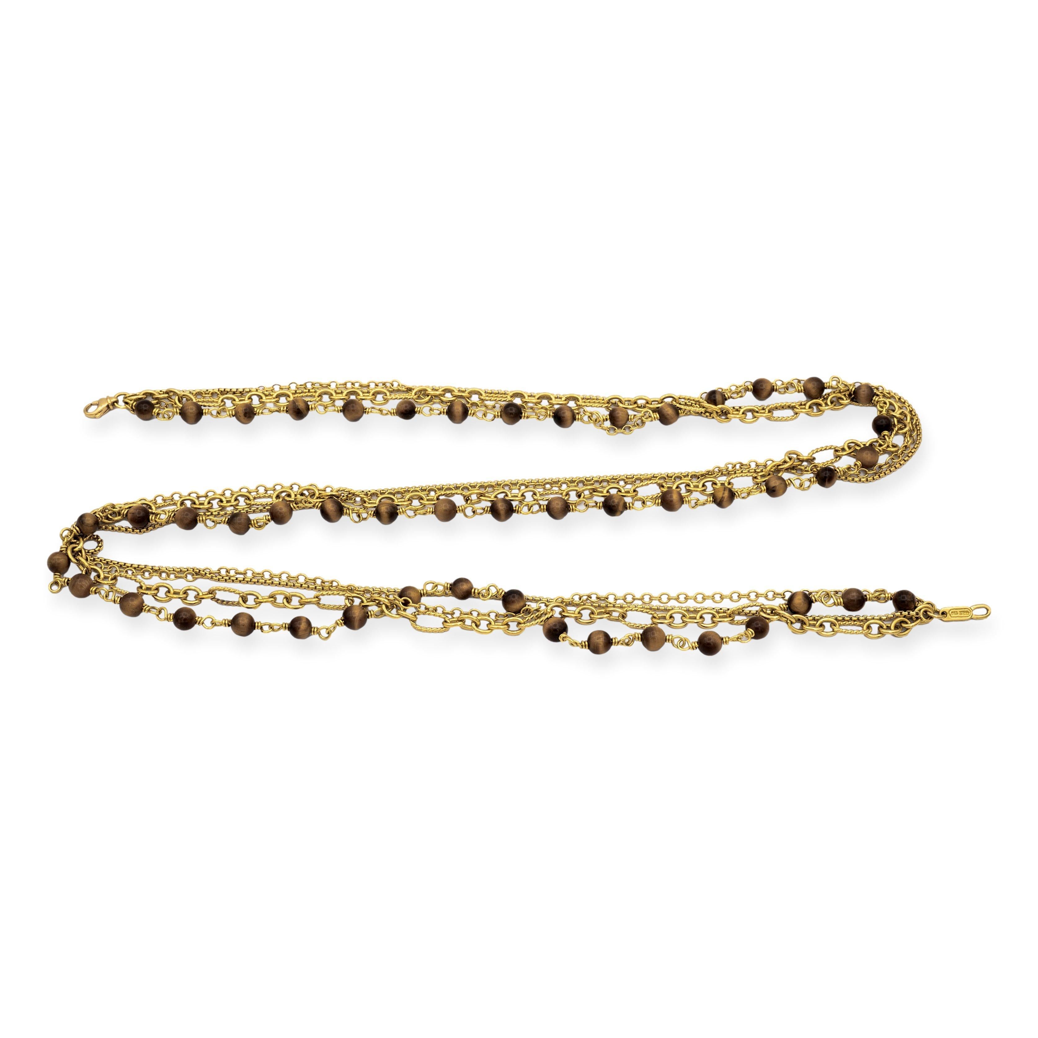 David Yurman Multi Chain necklace is layered by four strands from Yurman's signature link chain collections, with one strand adorned with 50 tiger eye spiritual beads measuring 6 mm each. This 31 inch necklace is secured by a convenient lobster