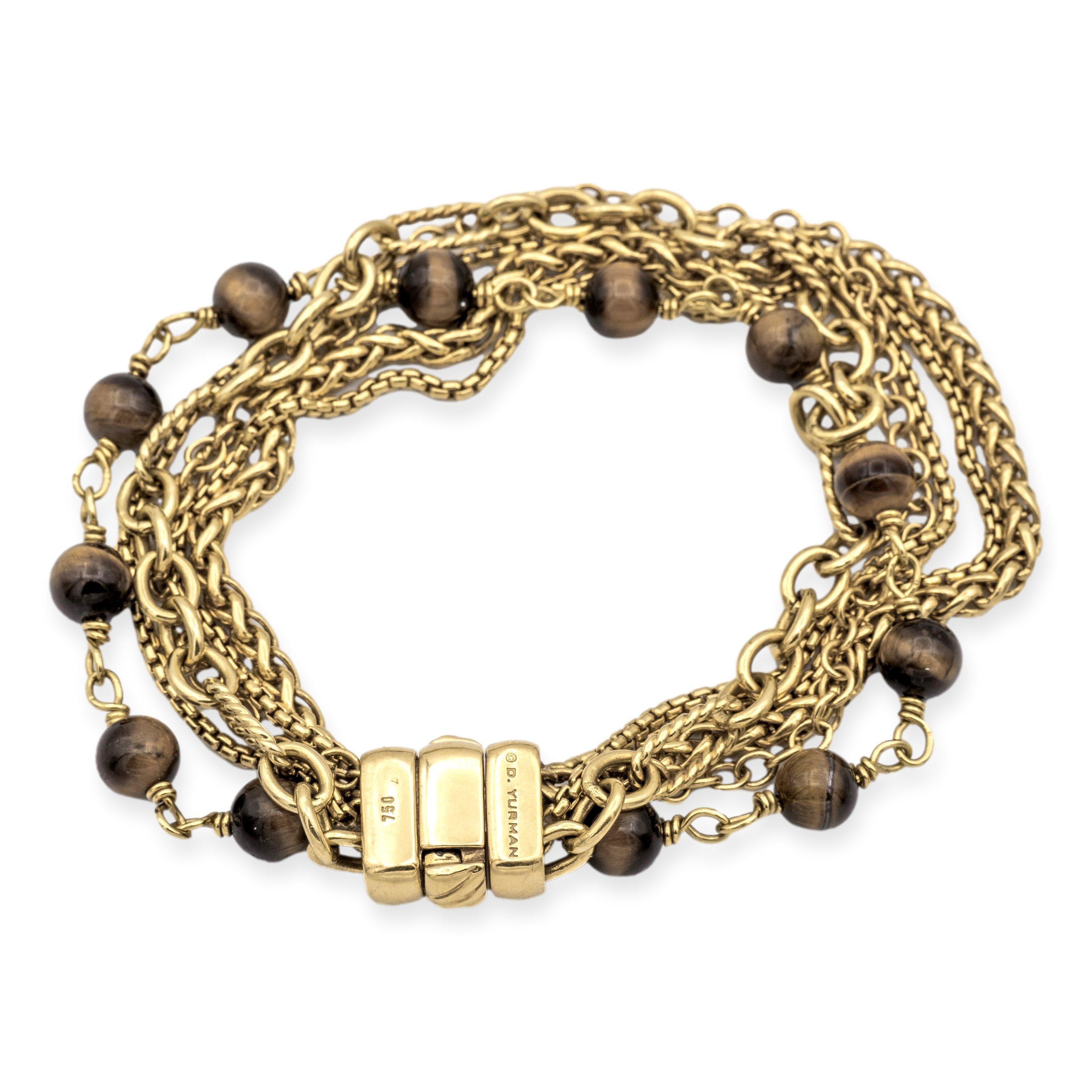 David Yurman Multi Chain Bracelet featuring six strands from Yurman's signature link chain collections, with one strand adorned with tiger eye spiritual beads measuring 6 mm each. The 7.5-inch bracelet ensures a comfortable fit, secured by a