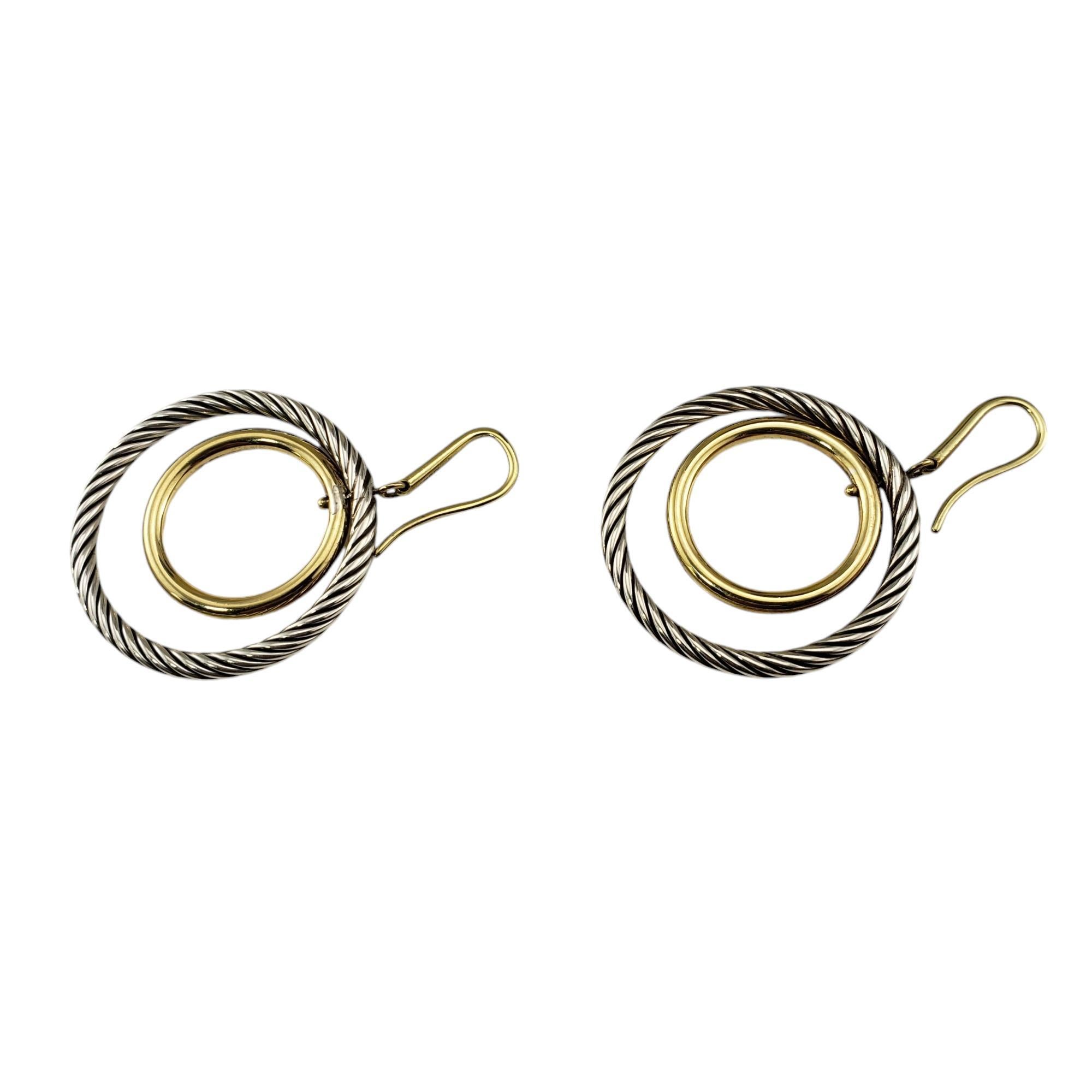 David Yurman 18K Yellow Gold Plated and Sterling Silver Mobile Hoop Earrings-

These lovely double hoop David Yurman earrings are crafted in beautifully detailed sterling silver. Mobile circle is yellow gold plated. Wire posts are 18K gold.

Size: