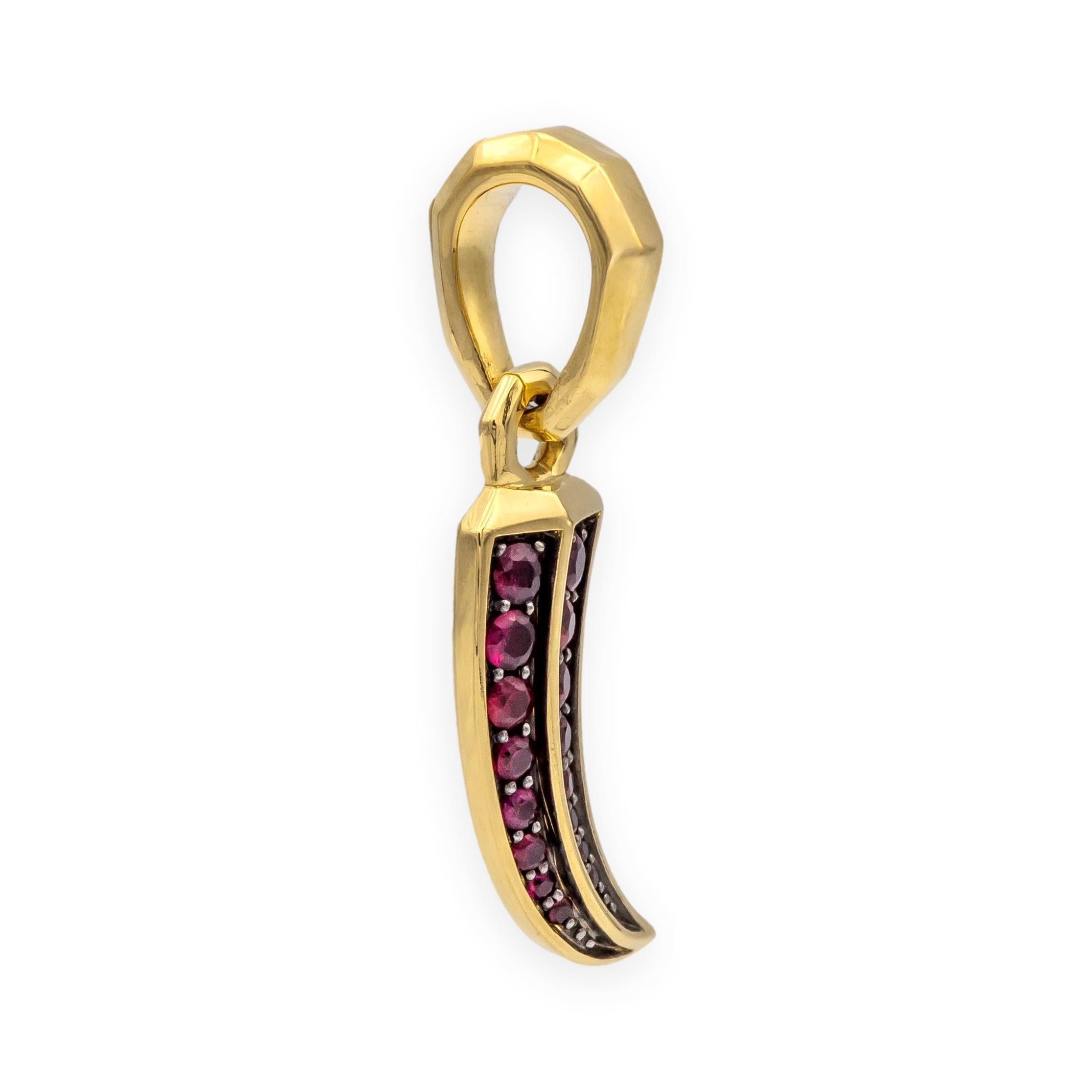 A striking and symbolic design from David Yurman’s Amulets Collection, this pendant features a curved claw pavé-set with sixteen vibrant round rubies in 18K yellow gold. The rubies display a rich red hue which contrasts beautifully with the warm