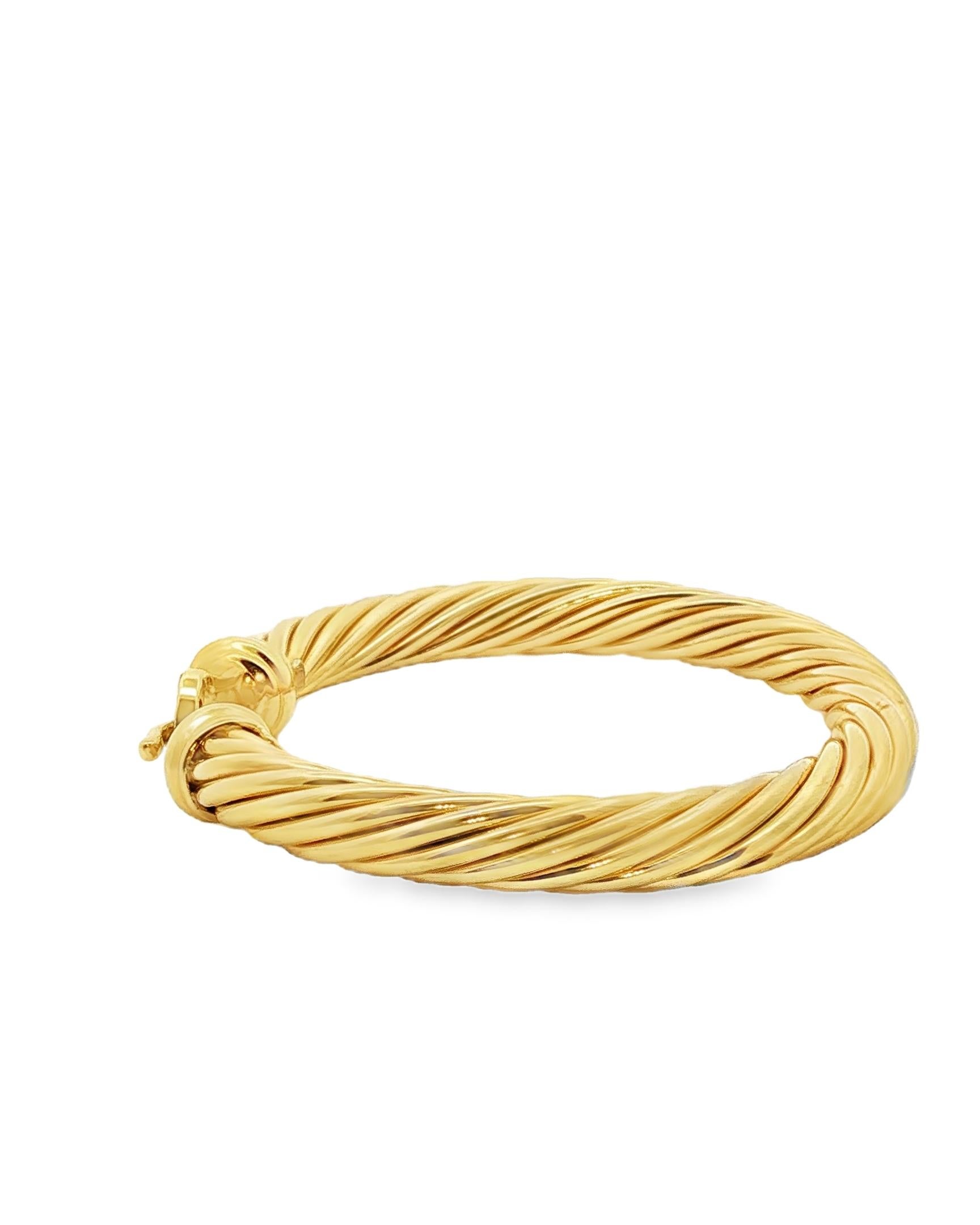 18K yellow gold cable bangle bracelet with petite round diamonds. Designed for daily wear or more formal outfits. This is a stackable statement bracelet.