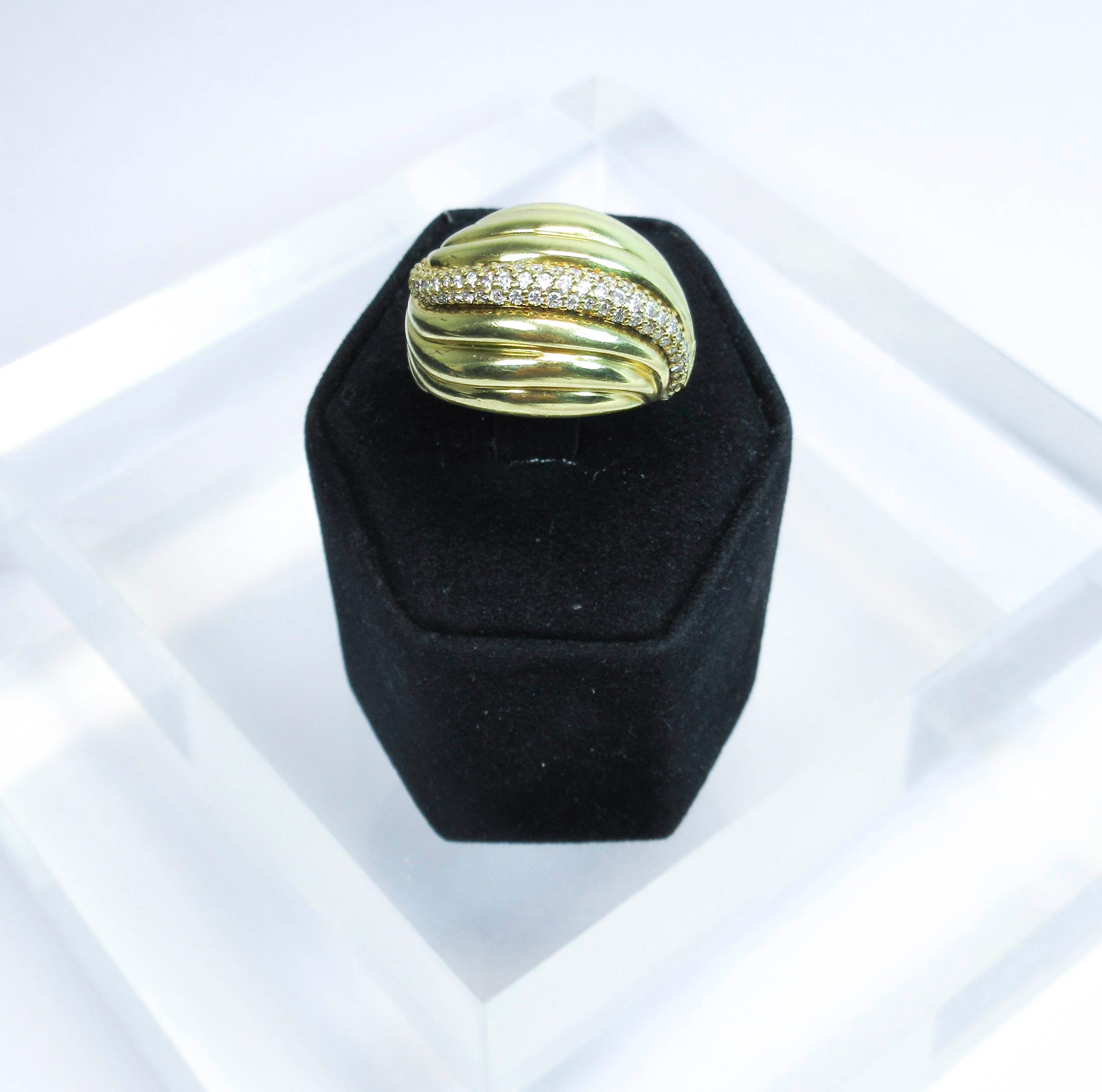 This David Yurman design is composed of 18kt yellow gold and features diamond accents. Size 7.5. Please feel free to ask any additional questions you may have.