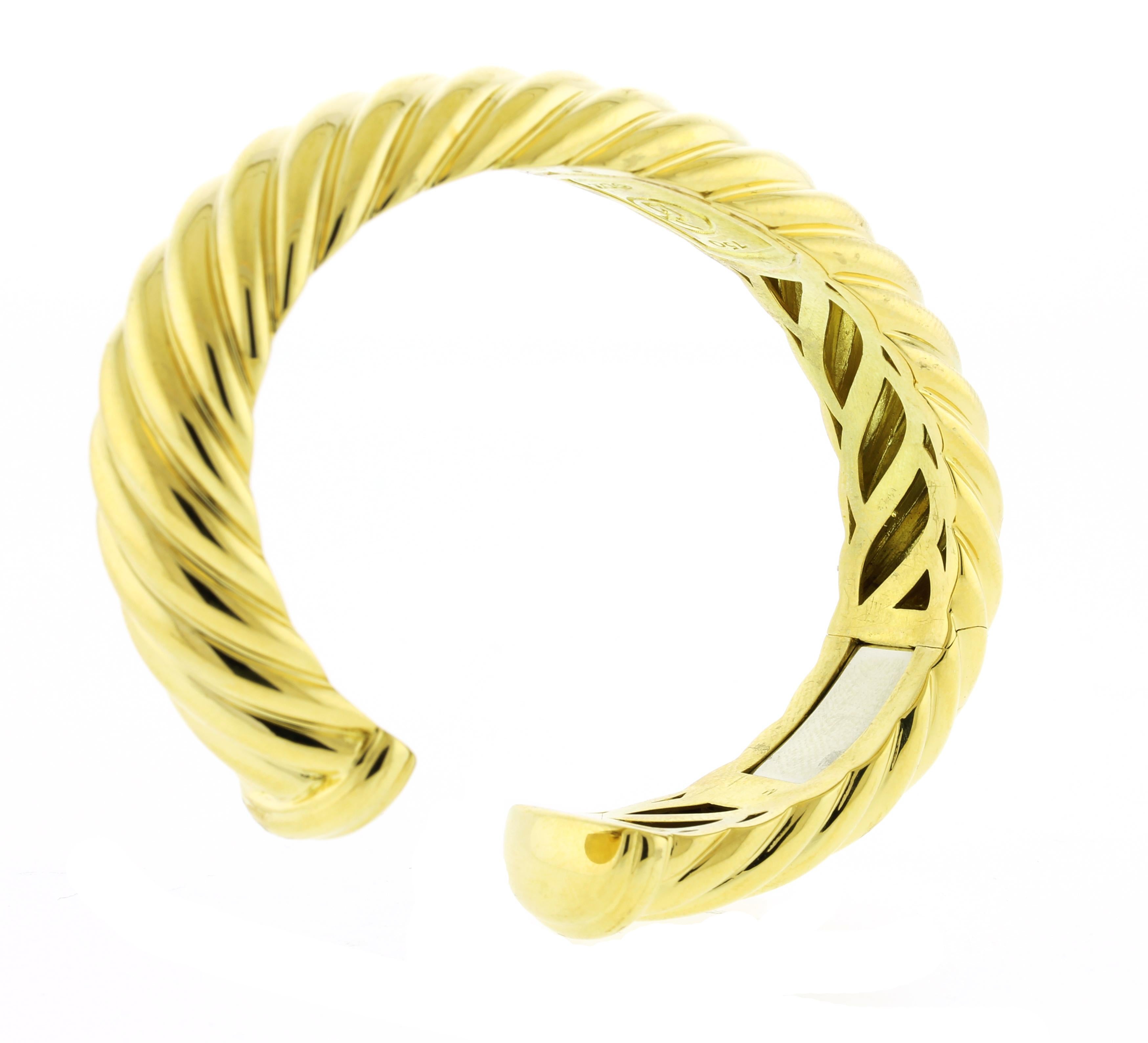 From David Yurman, this grooved bracelet is great for any occasion.
♦ Designer: David Yurman
♦ Metal: 18kt yellow gold 
♦ Inside Diameter: 2 1/4 by 1 5/8
♦ Weight =54 grams
♦ Pampillonia Presentation Box
♦ Condition: Excellent, pre-owned