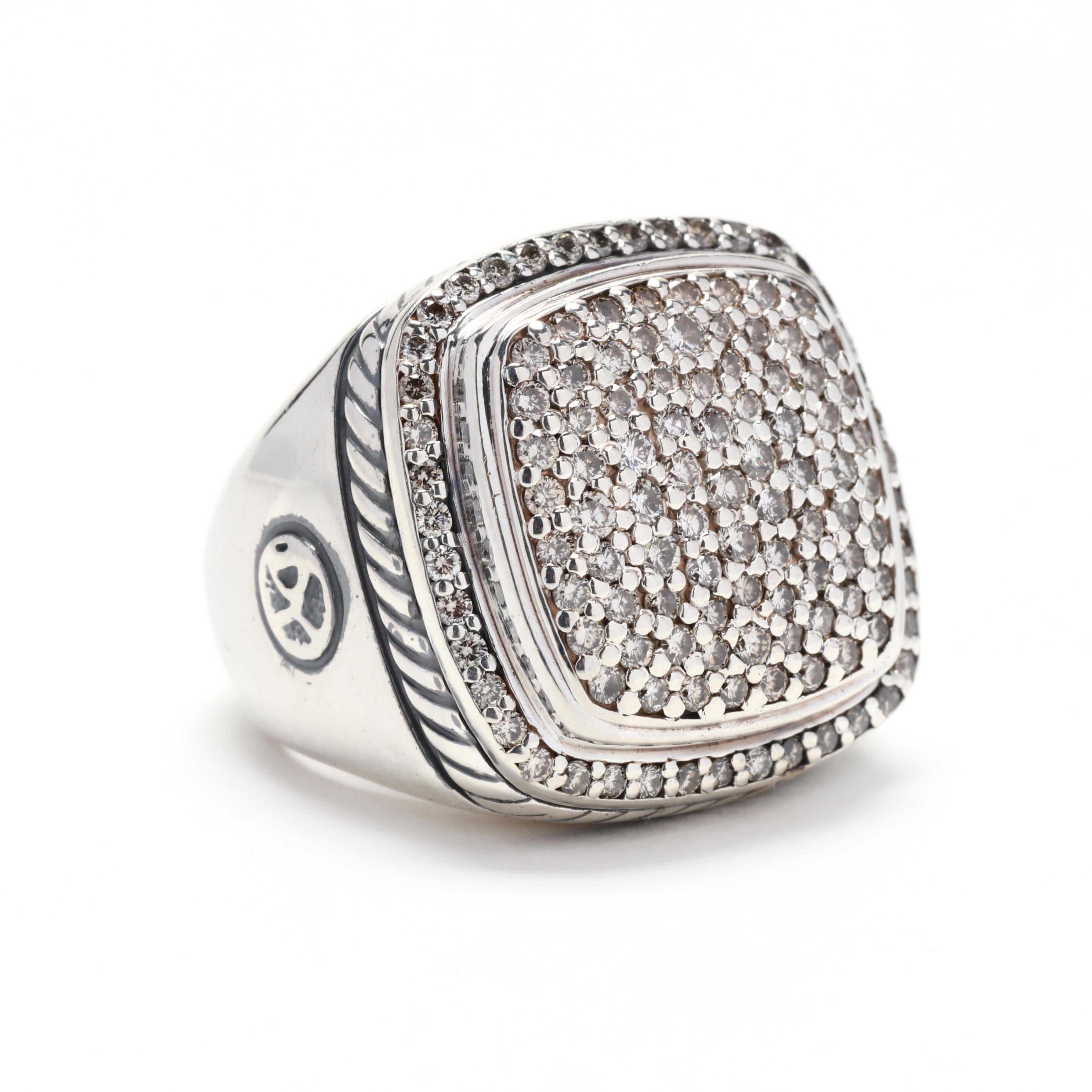 A vintage sterling silver pavé diamond statement ring by David Yurman. This ring from the Albion collection features a cushion shape with pavé set dull cut round diamonds weighing approximately 1 total carats with a cable motif border and a tapered