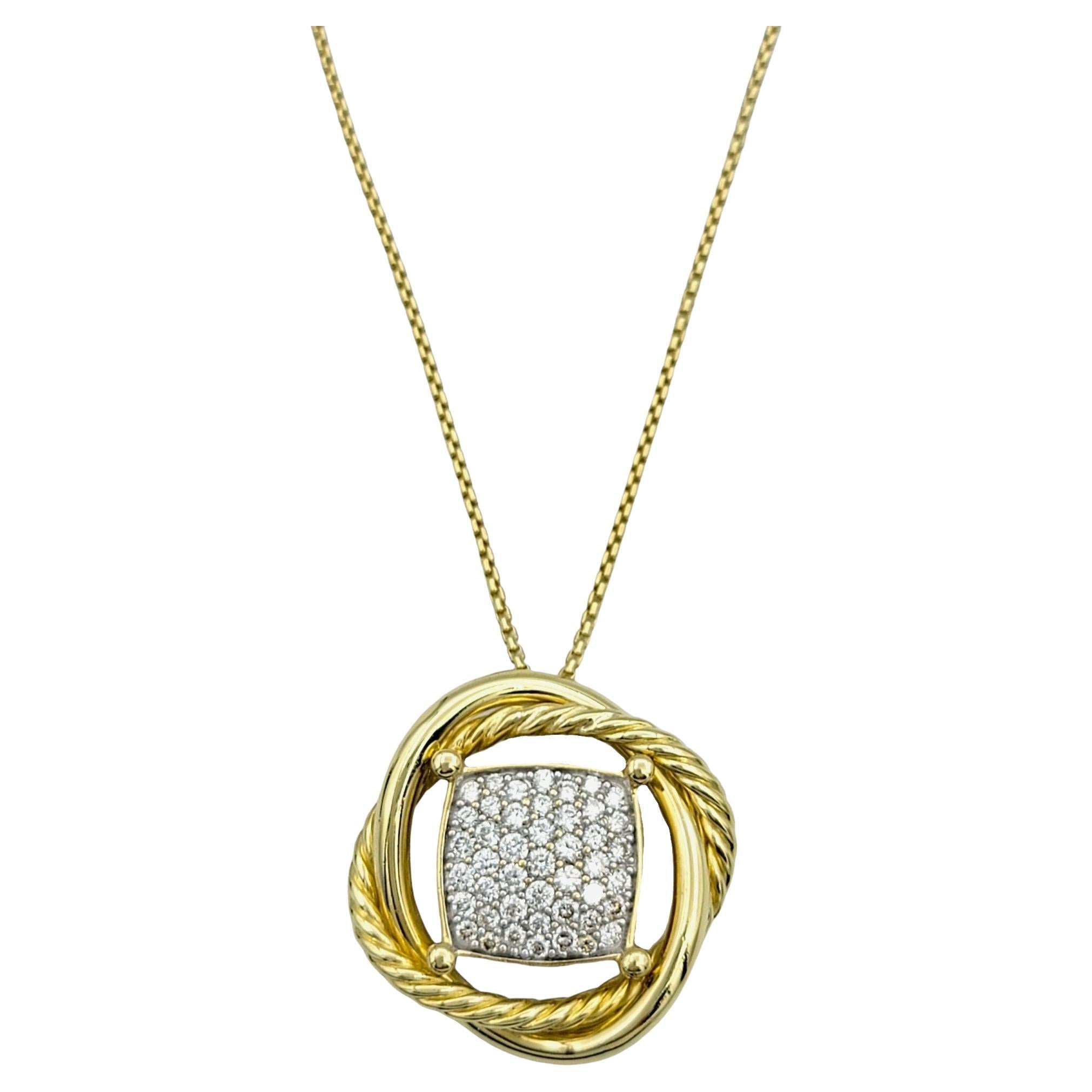 Experience the epitome of sophistication with the David Yurman Infinity Pendant Necklace, reimagined in luxurious 18K yellow gold and adorned with pave diamonds. The modernized pendant showcases interlacing links of smooth and cabled metal, creating