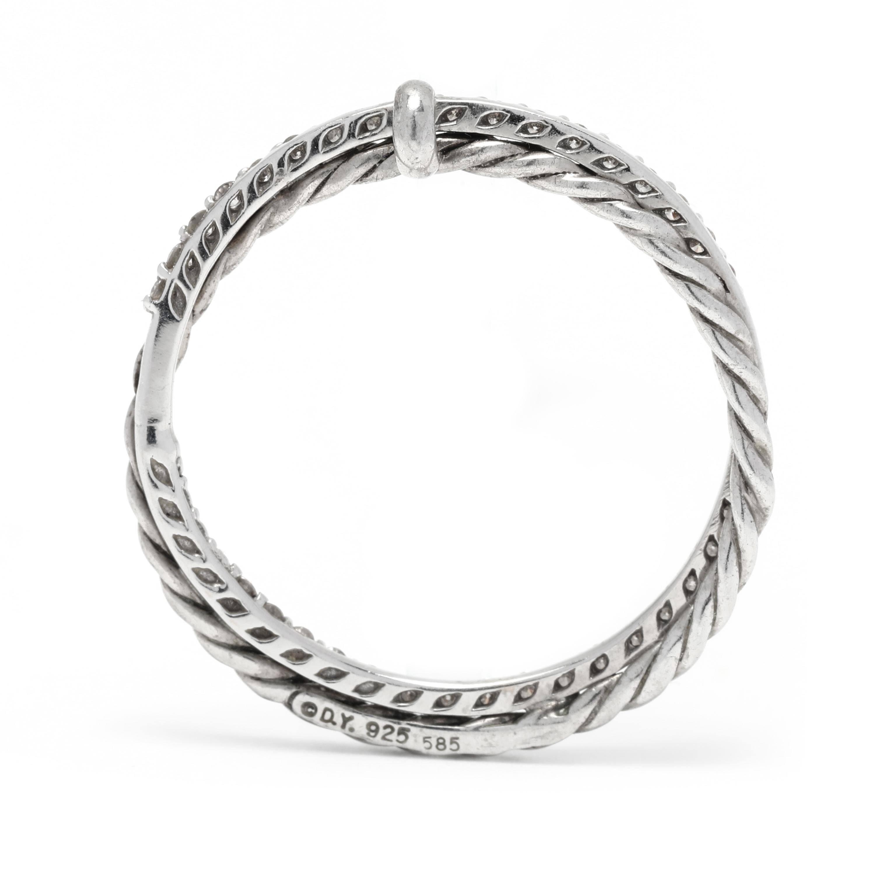This stunning David Yurman pendant features a beautiful interlocking circle design crafted in 14K white gold and sterling silver. The pendant features a diamond-studded top with a total of .20ctw of diamonds, set in a pave setting. The pendant