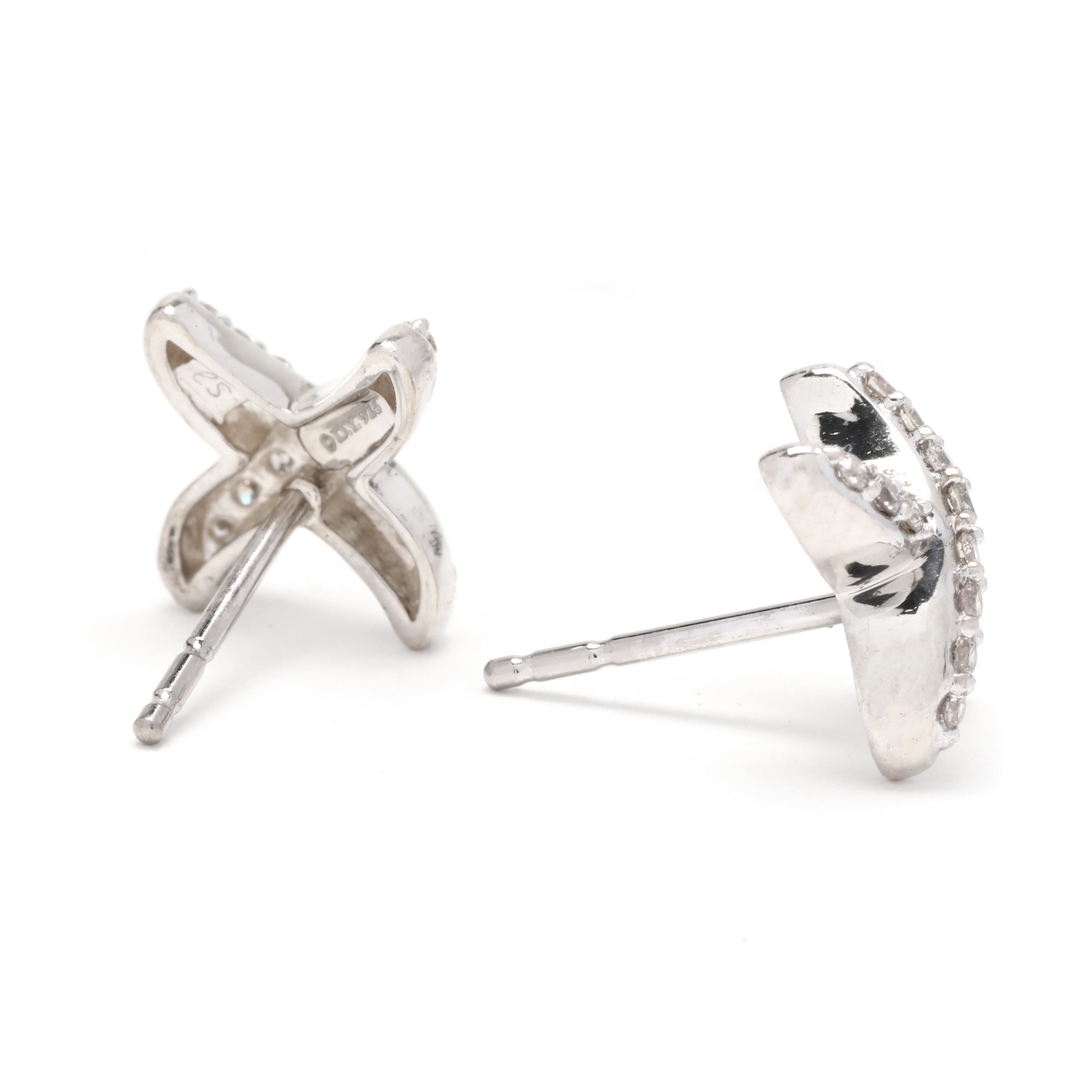 Ces boucles d'oreilles classiques et sophistiquées David Yurman en argent sterling, ornées d'un diamant X de 0,25 ctw, sont le complément idéal de votre collection de bijoux. Ces boucles d'oreilles étonnantes présentent un design en X simple mais