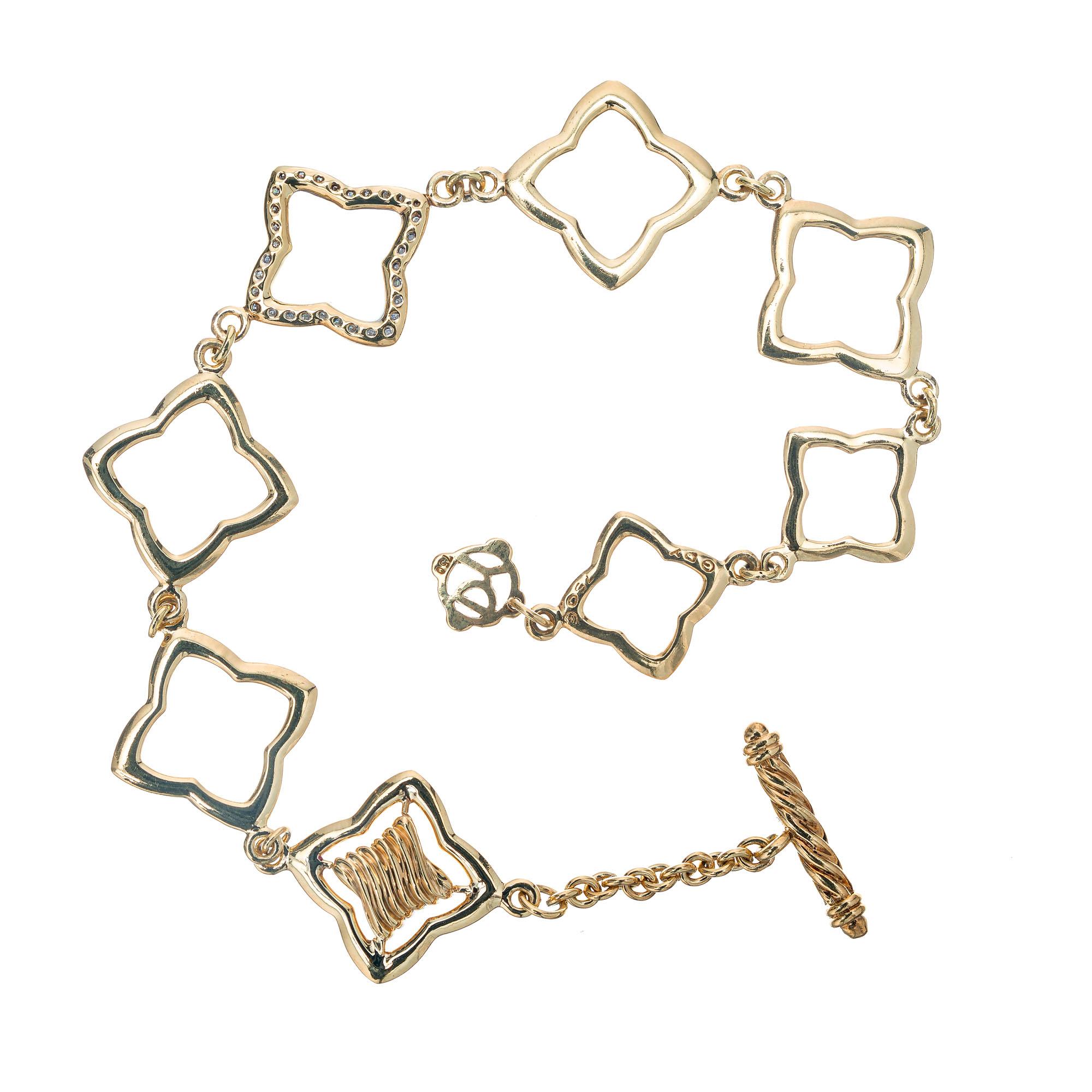 Authentic David Yurman solid 18k gold 8 link toggle diamond quatrefoil bracelet. 7.75 inches in length. 

32 full cut diamonds approx. total weight .32cts, G, VS
D Y tag
Stamped: D Y 750
Length: 7 3/4 inches
Width: 5/8 inch or 17.5mm
Fits a standard