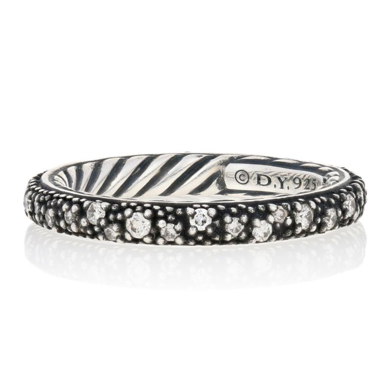 Step out in style with David Yurman! Part of the Midnight Melange Collection, this enchanting eternity band features a bead-textured exterior sparkling with white diamonds, and Yurman’s signature cable design adorns the ring’s interior. This