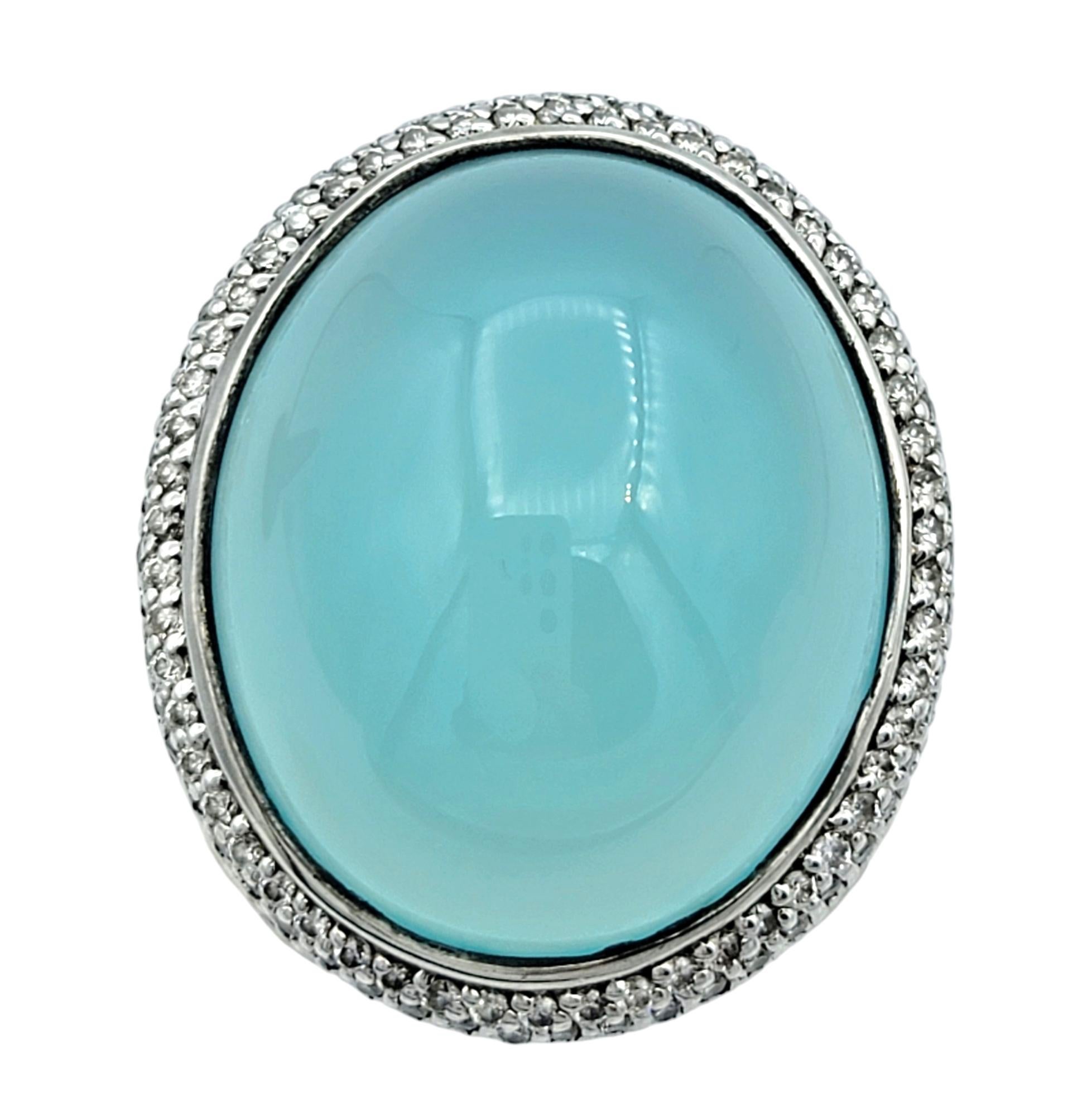 Ring Size: 7
 
Unveil the captivating elegance of this authentic David Yurman cocktail ring, a masterpiece of artistic design and luxury. At the heart of this piece lies a stunning oval-shaped cabochon chalcedony, radiating a soft, ethereal glow