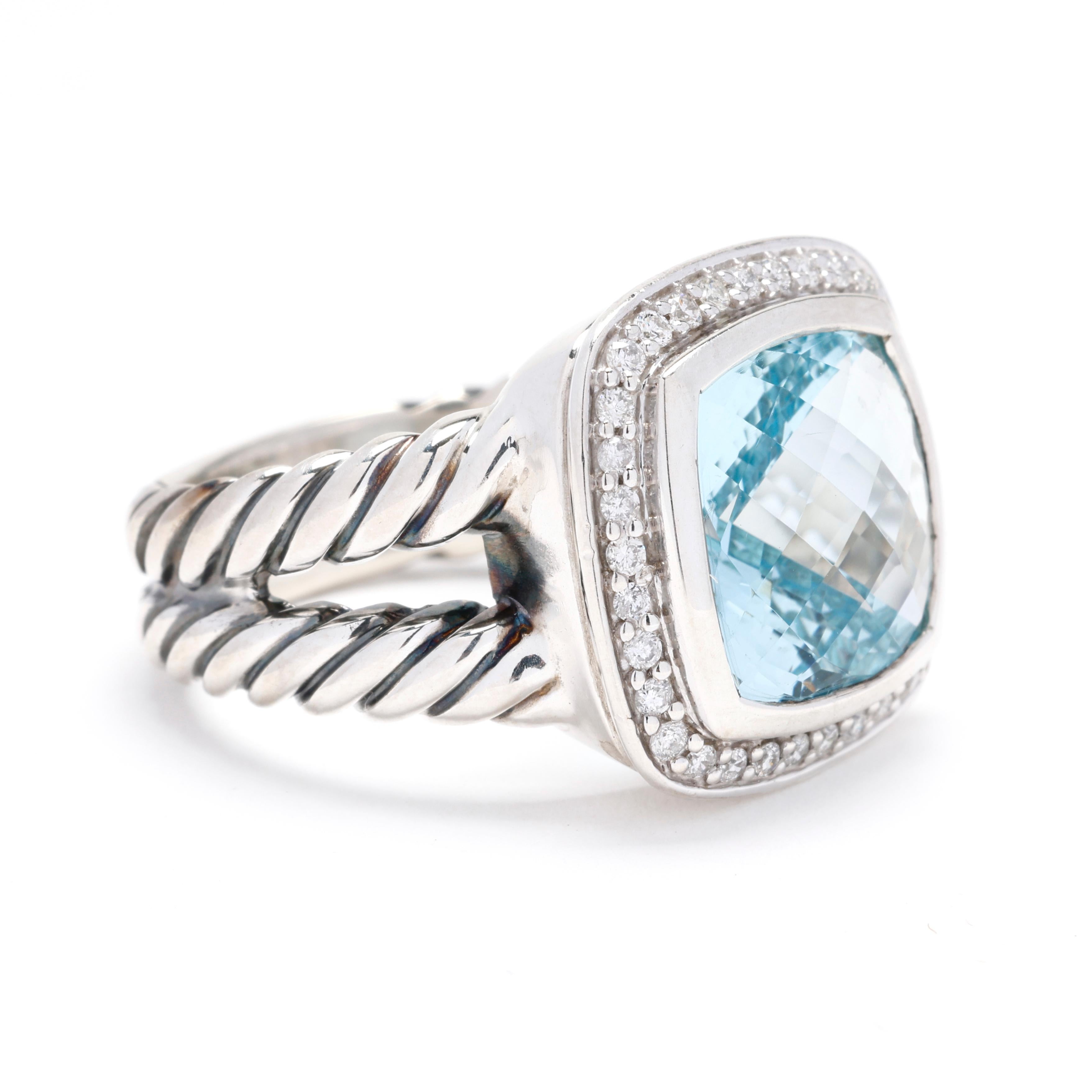 Experience the unparalleled elegance of this David Yurman 6.17ctw Blue Topaz and Diamond Ring. Meticulously crafted in high-quality sterling silver, this exquisite ring features a breathtaking blue topaz center stone accented by sparkling diamonds,