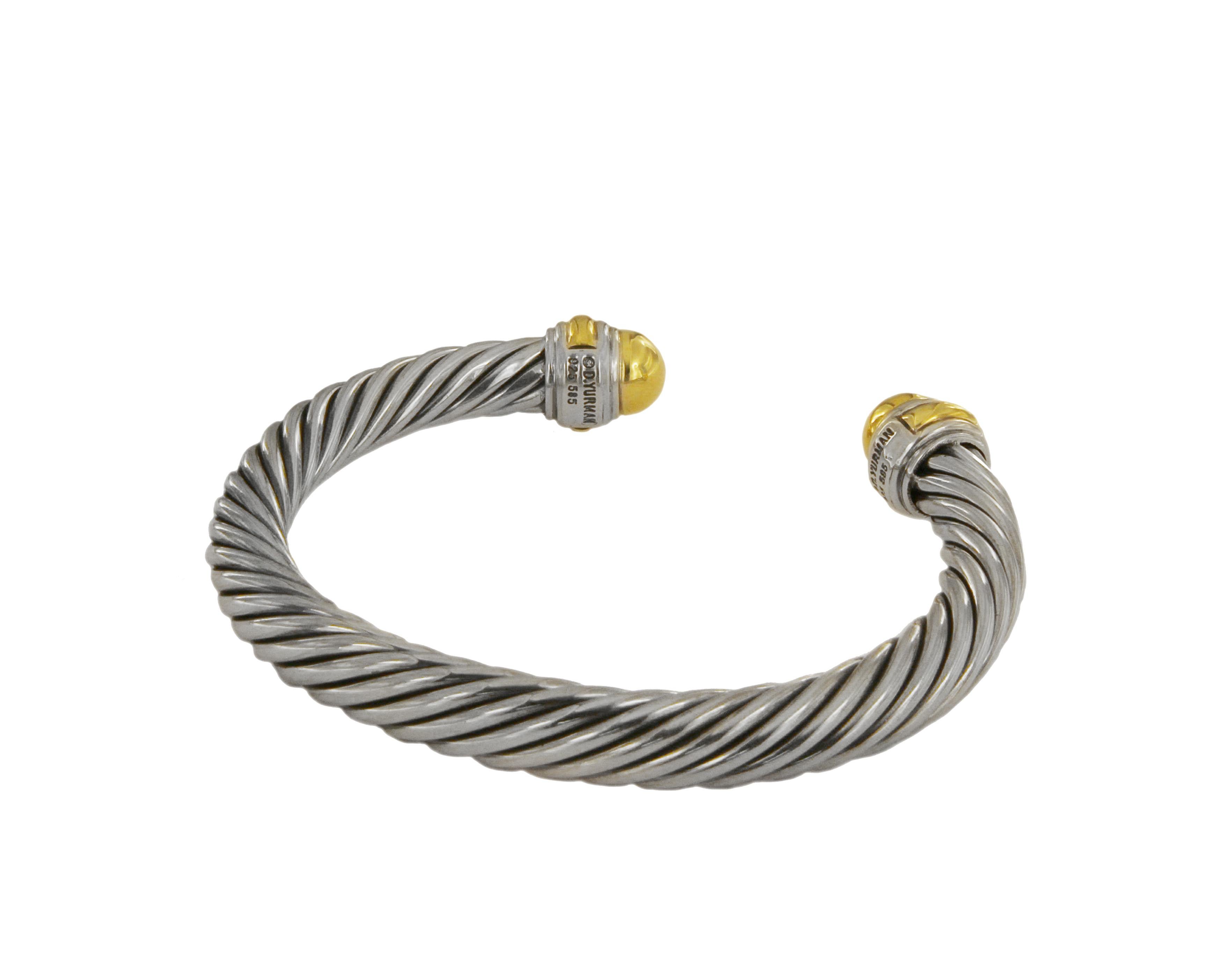 David Yurman bangle from the Cable Collection.
Mint condition
Sterling silver & 14k Yellow Gold
Width: 7mm
Medium size
Comes with David Yurman pouch
Retail: 825