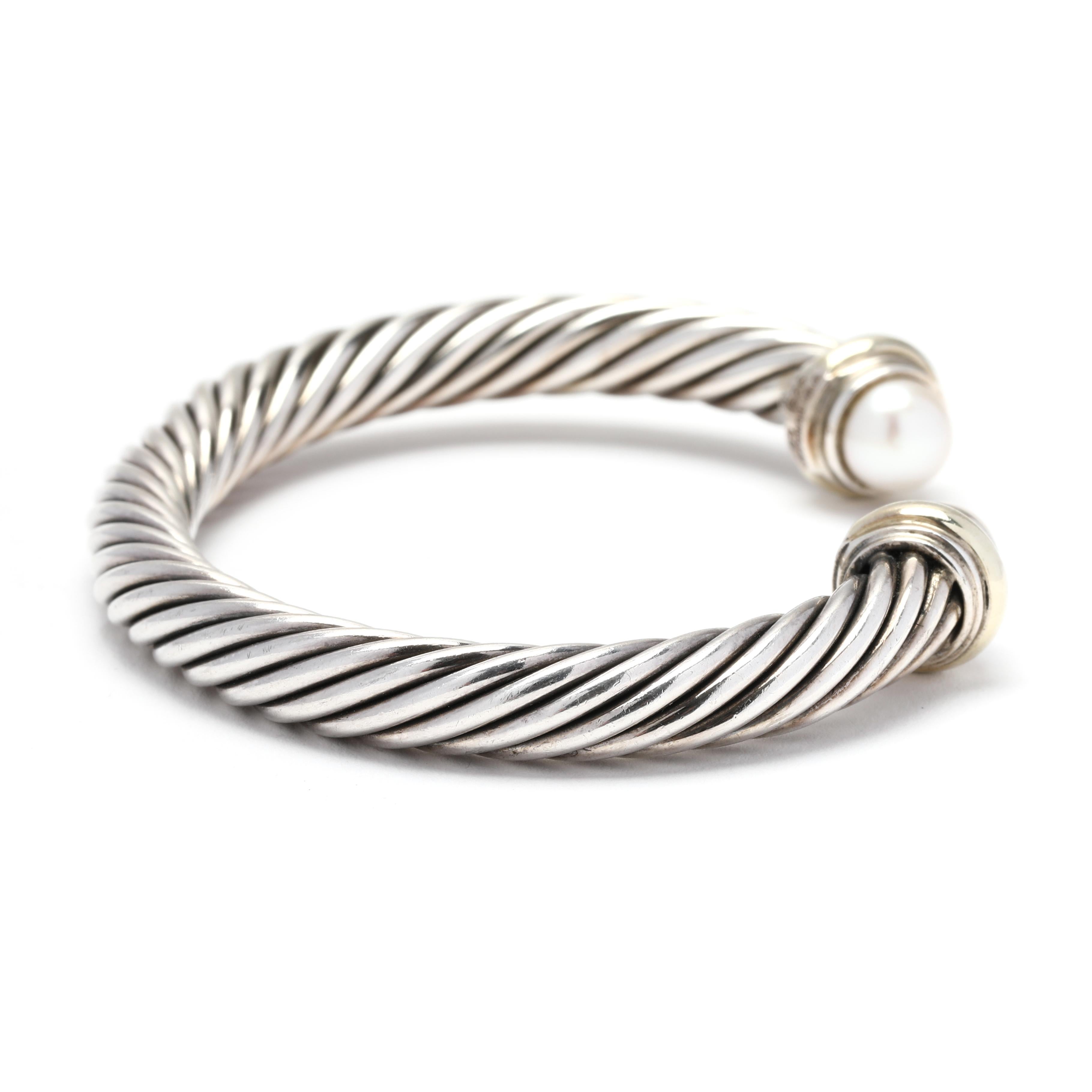 The David Yurman 7mm Pearl Cuff Bracelet is a gorgeous piece of jewelry that combines the elegance of pearls with the modernity of cable cuff design. Made from 14K yellow gold and sterling silver, this bracelet is of high-quality and will last for